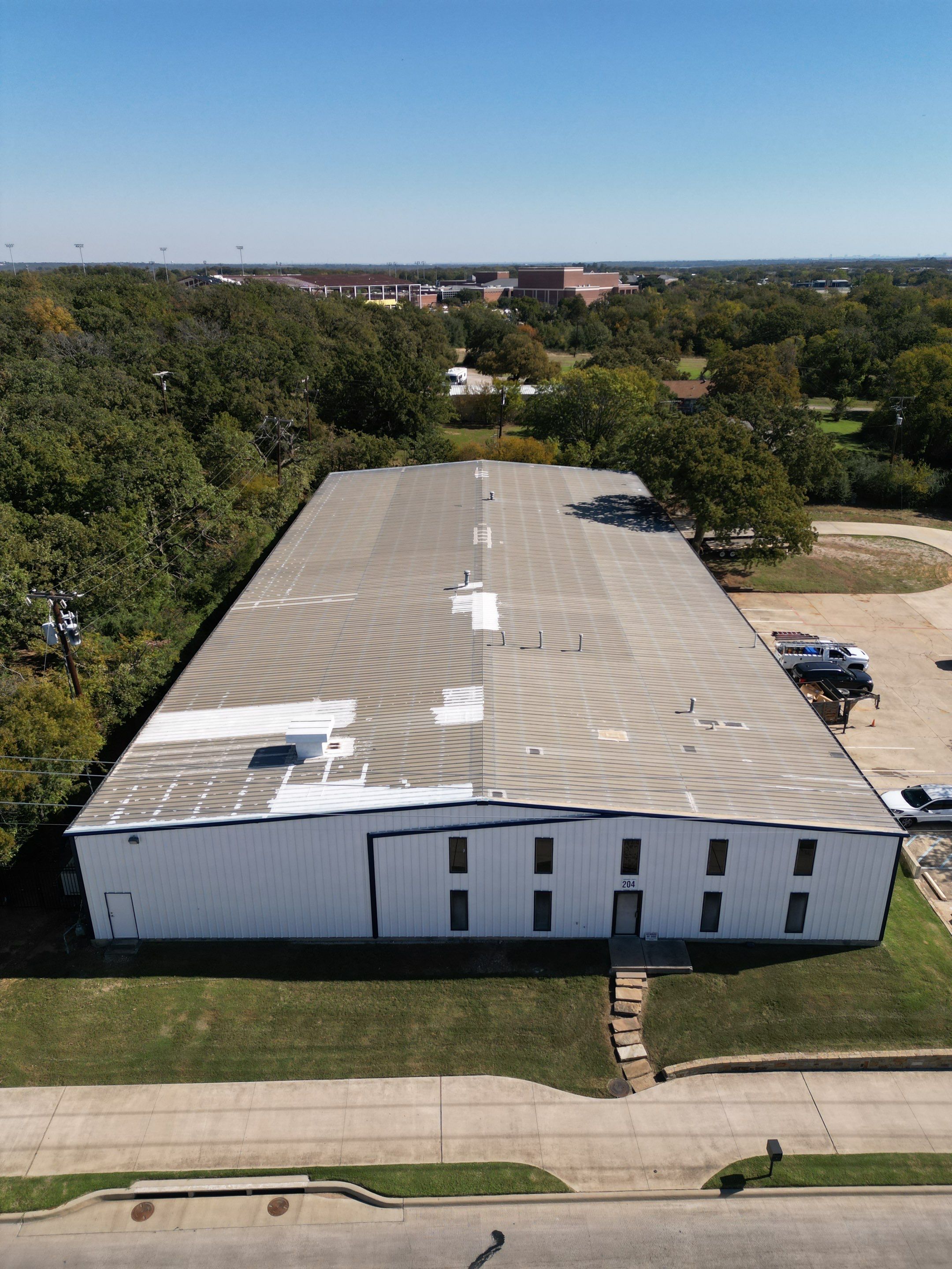 Silicone Coating Metal Rehab by First Out Roofing 