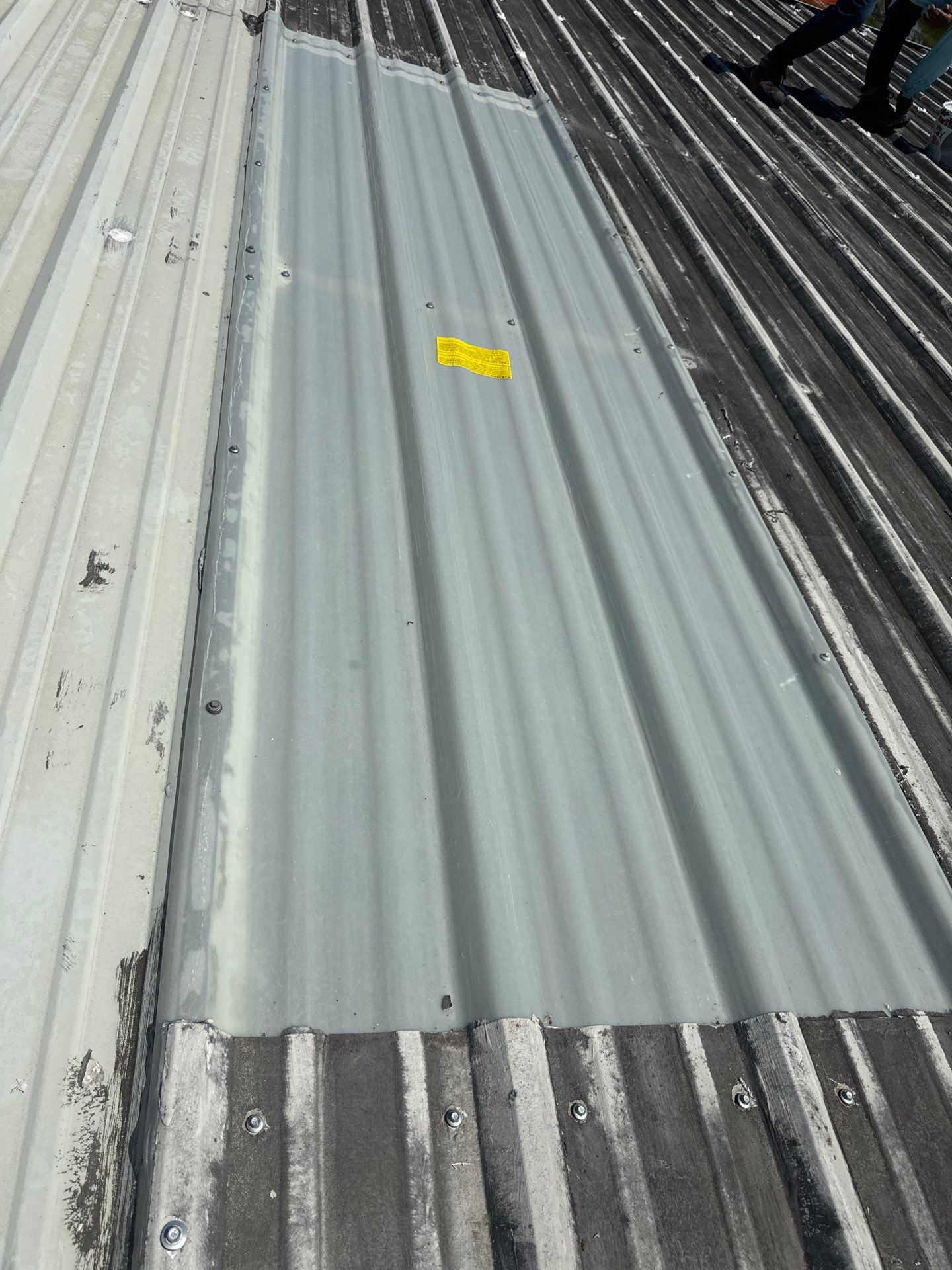 Metal Roof Maintenance- Skylight Installation  by Associates Roofing Unlimited 