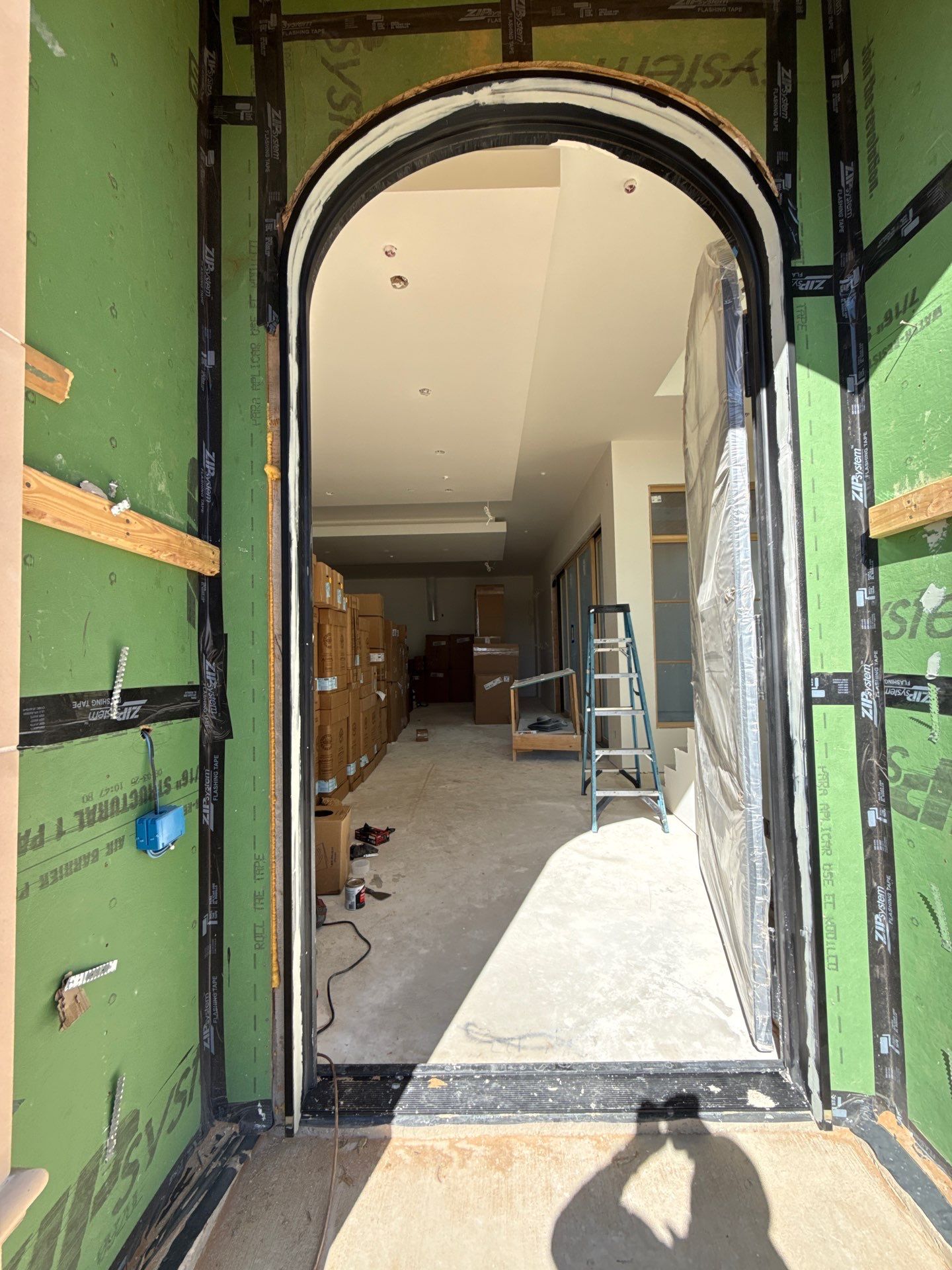 Custom Black Metal Arched Entry Door Installation in Southlake by Solara Custom Living