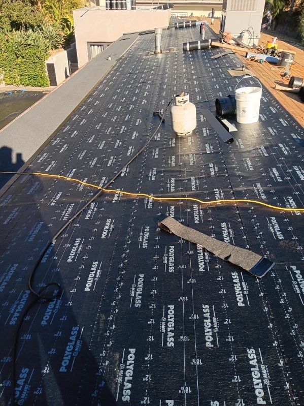 Residential Roofing Installation using Polyfresko® G Highly Reflective Modified Bitumen Cap Sheet by Hull Brothers Roofing