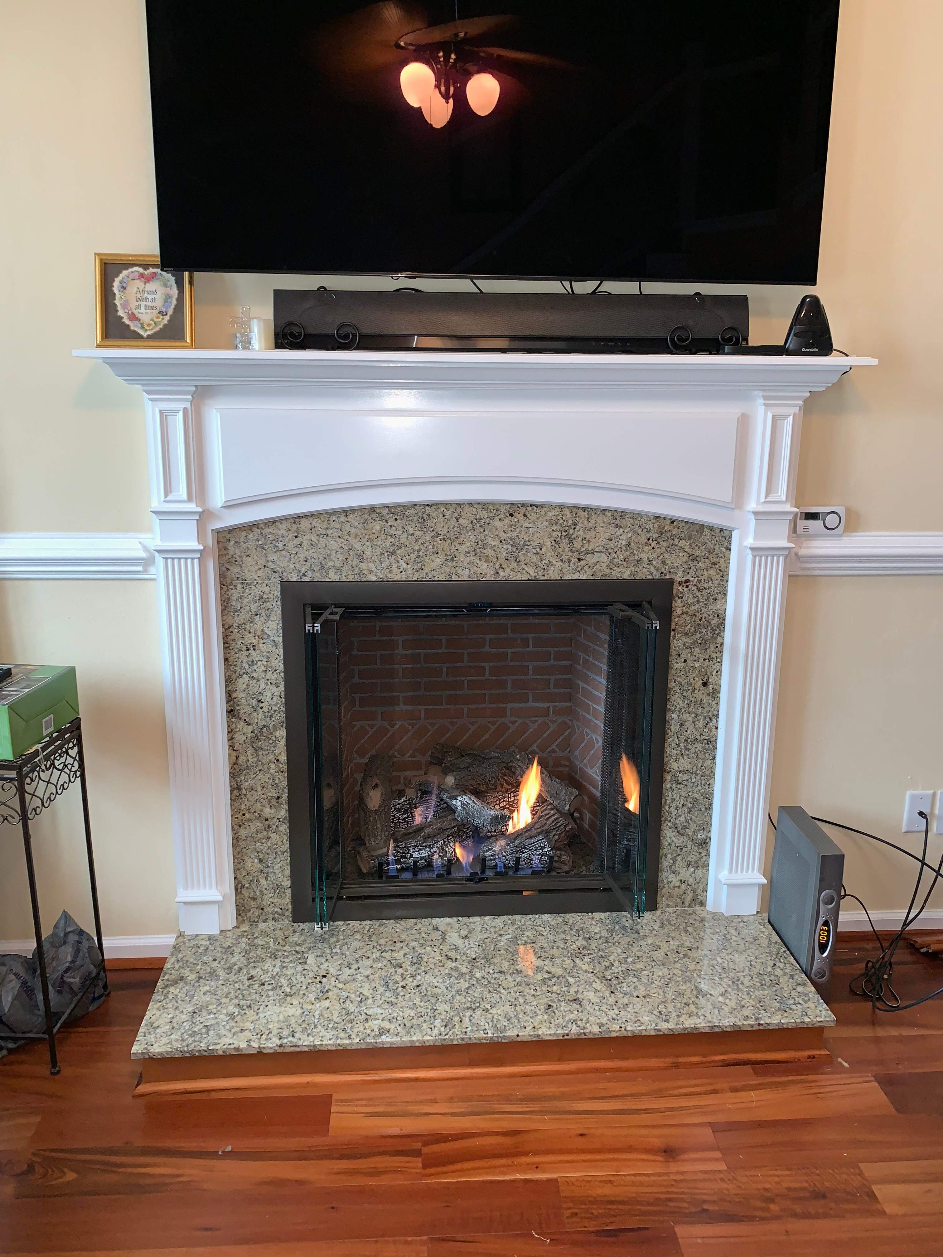 Gas Fireplace + Stone + Mantel by Premier Chimney and Roofing