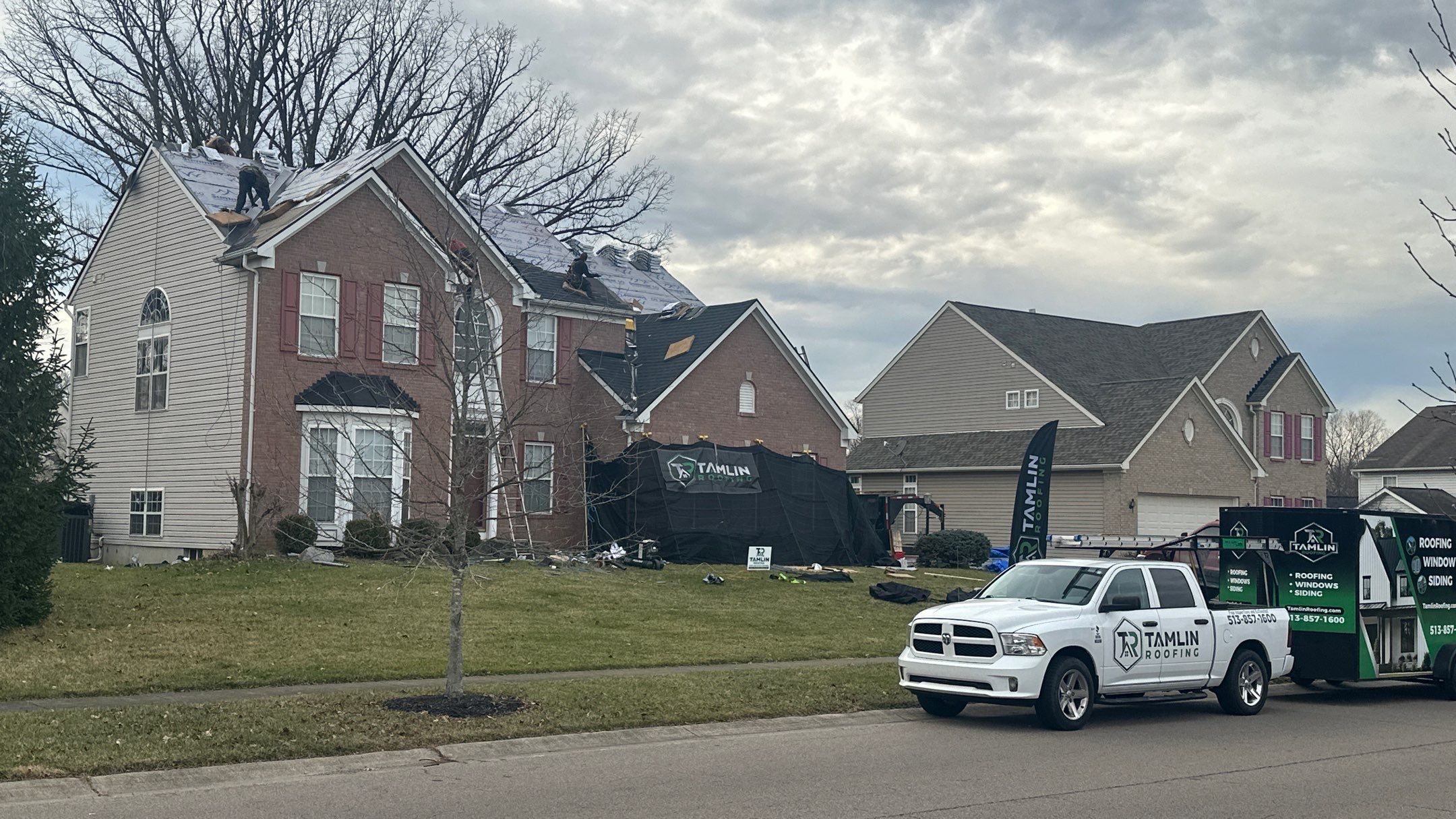 Walden Ponds - Pristine Black and Hydro Flo Gutter Guards by Tamlin Roofing