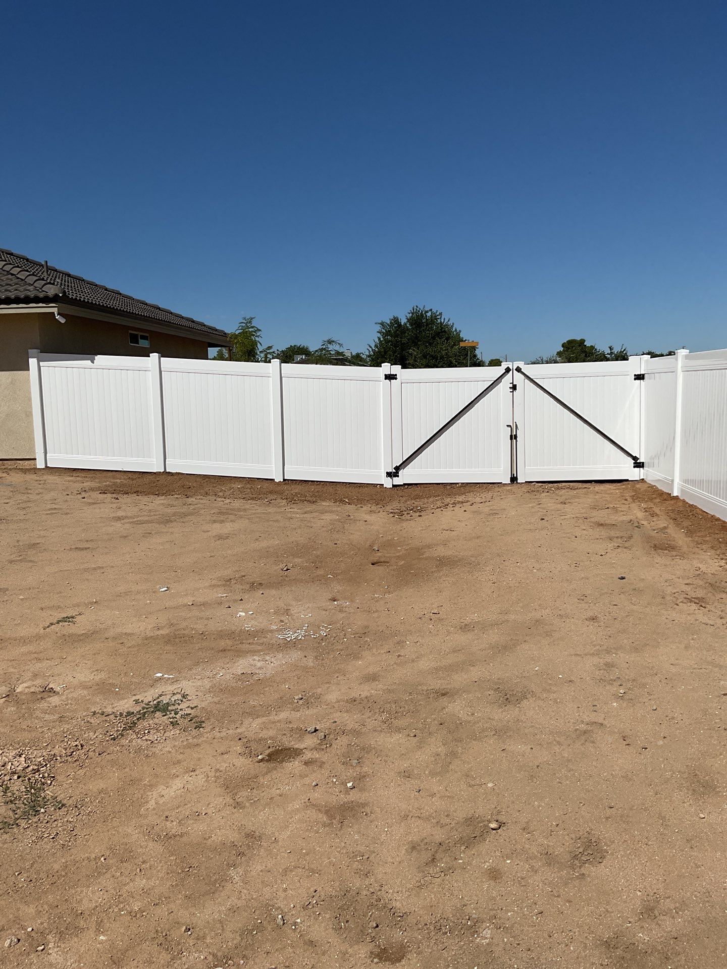 6ft White Privacy Vinyl Fence with Chain-link Fence by Fence Guys Inc.
