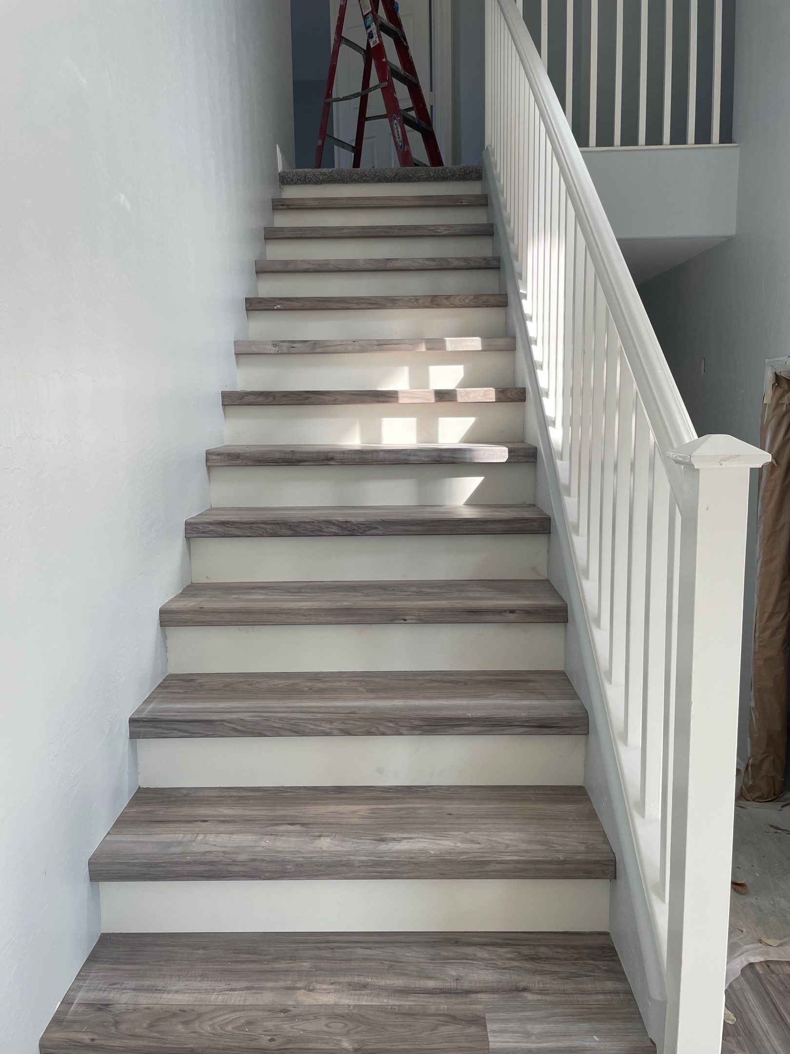 Laminate Staircase and Flooring  by Footprints Floors of Chandler 