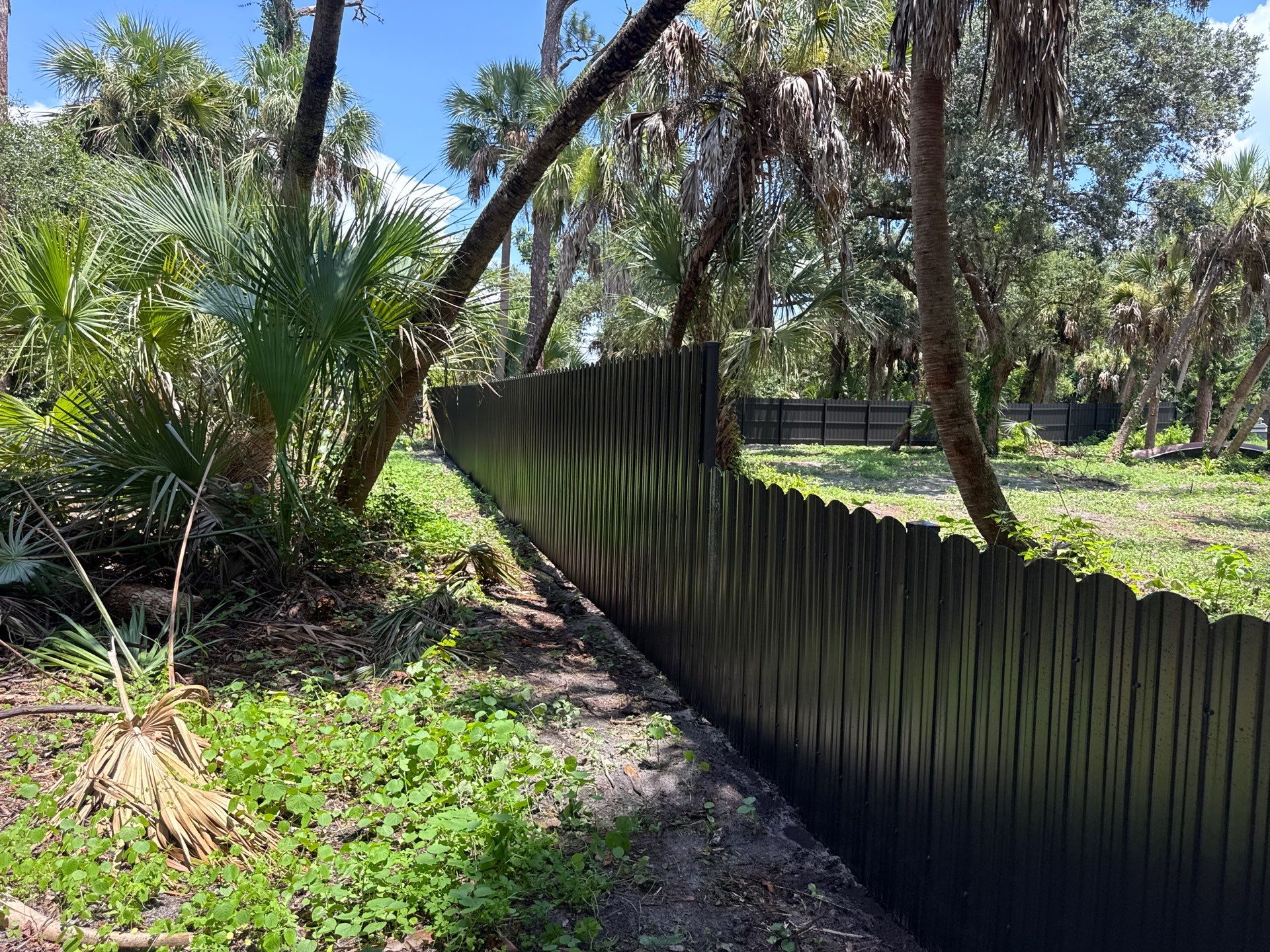 Bronze Scalloped Metal Privacy Fence Installation in North Port by True Fence LLC