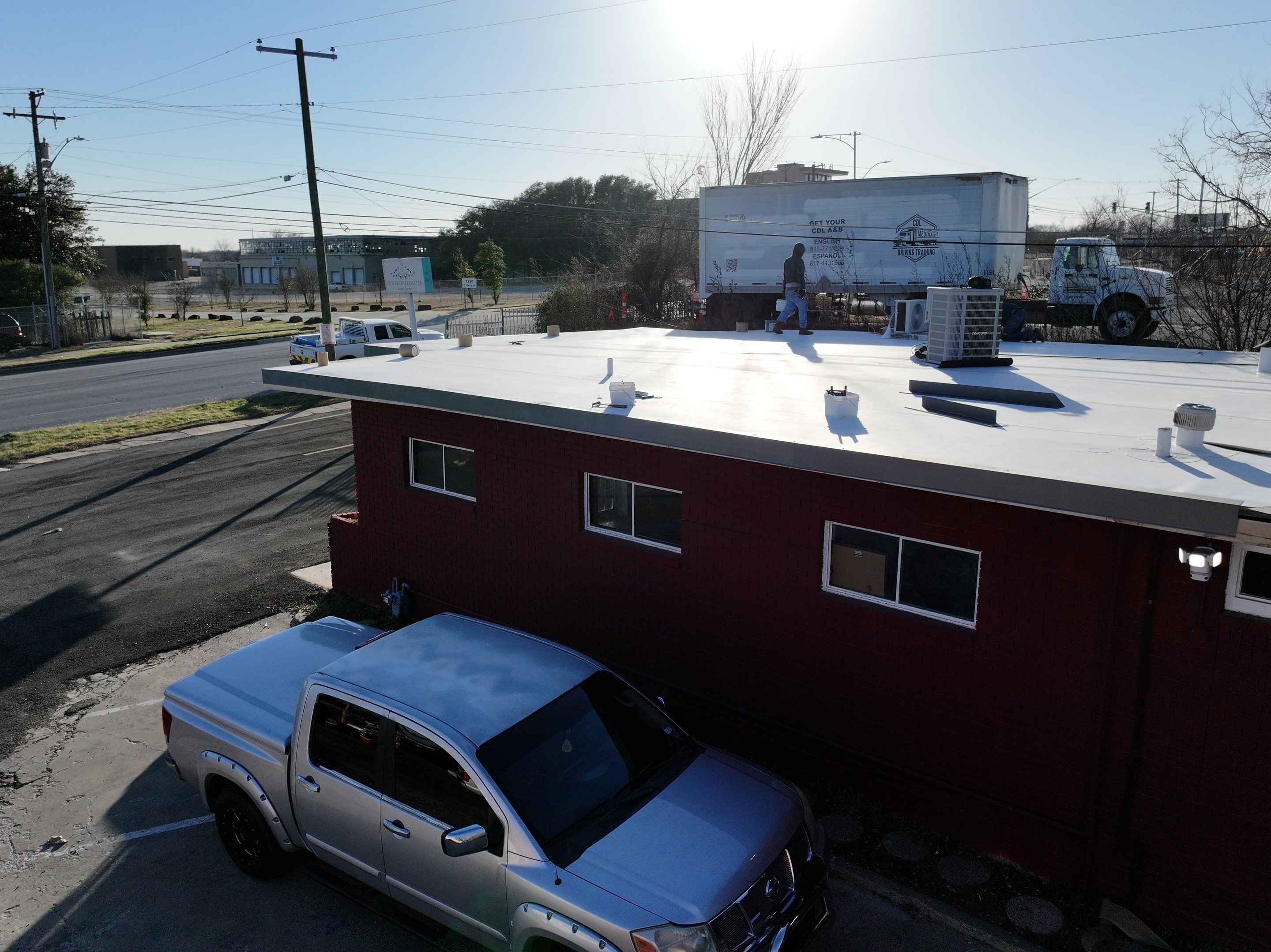 Commercial roofing overlay using GAF TPO over an old ballast roof by Becker Roofing and Exteriors