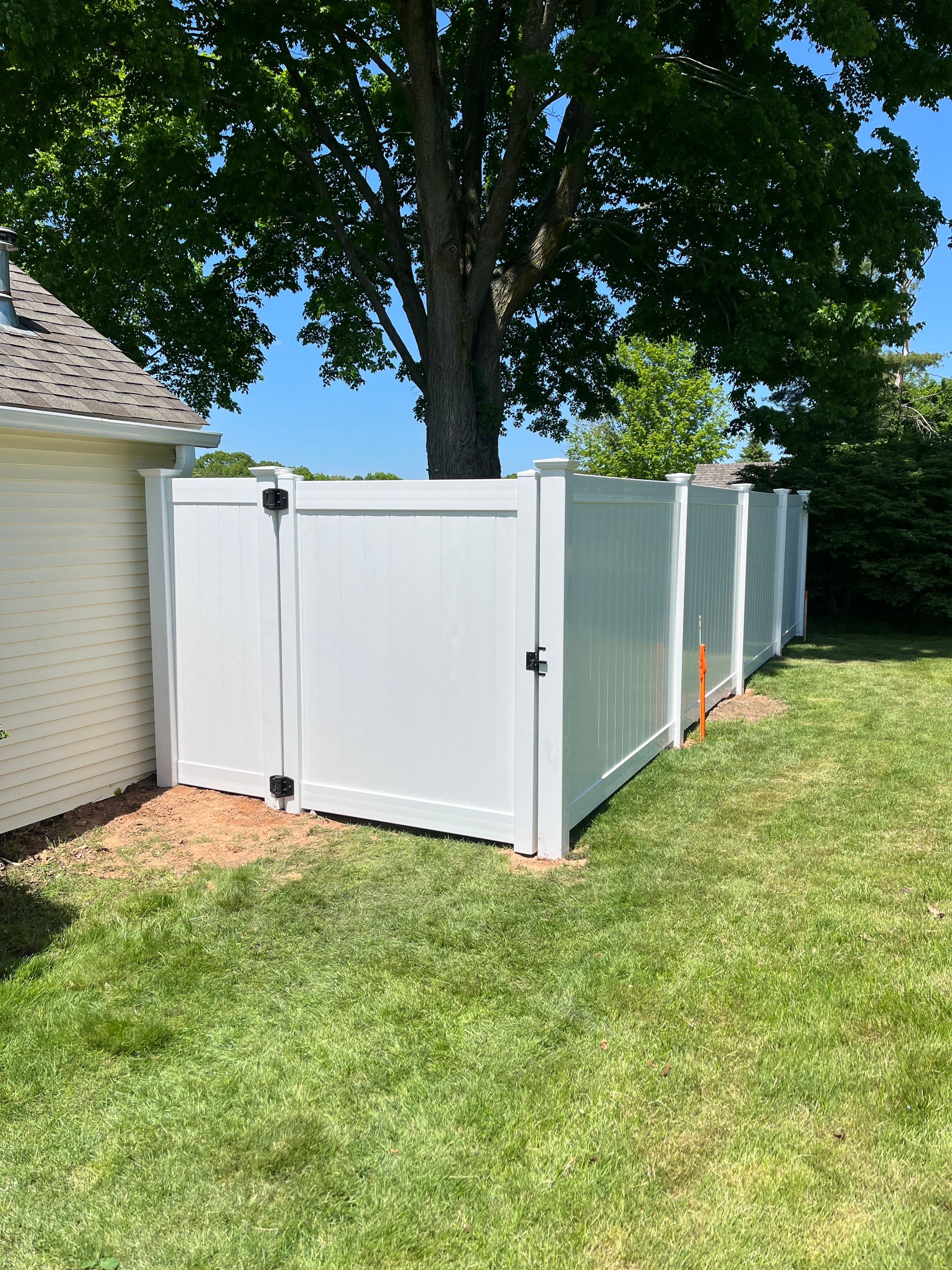 New Vinyl Privacy Fence with matching Gate in white. by DiGiorgi Roofing and Siding Inc
