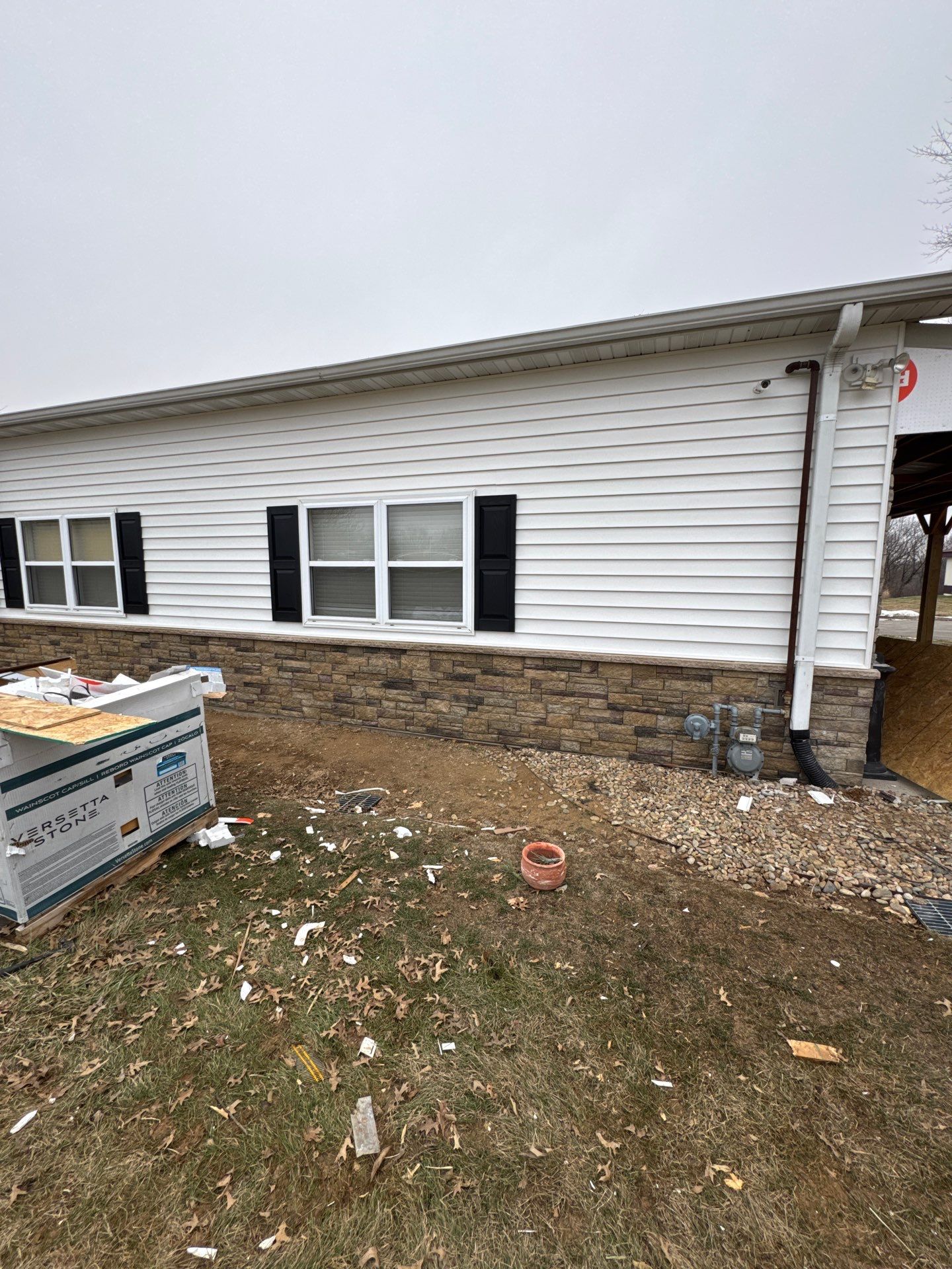 Siding and Stone Installation using Extrerior Porfolio Vinyl Siding and Versetta Stone by EEC  Windows, Siding & Roofing 