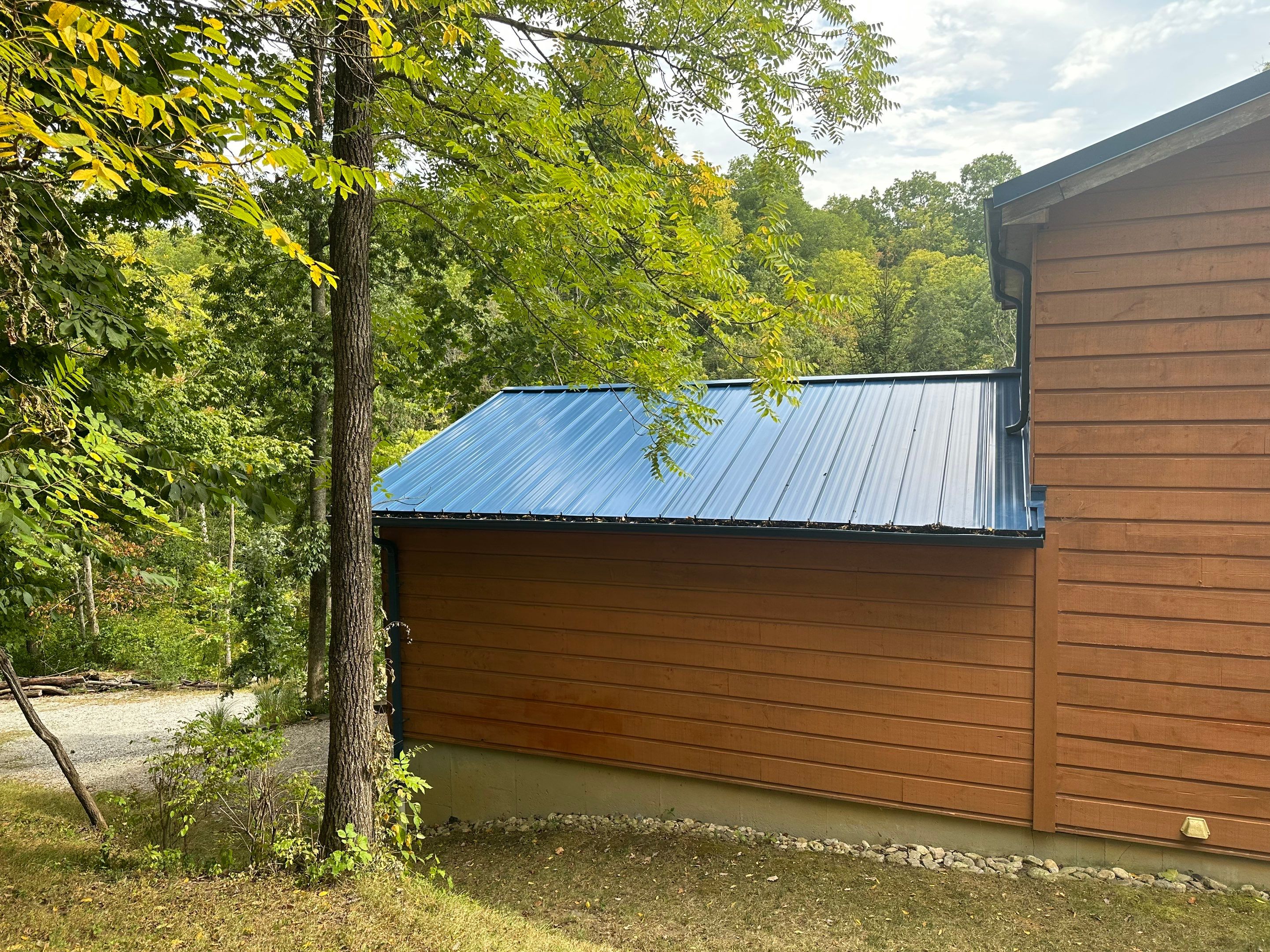 Residential Roofing Installation using Standing Seam Metal - Gallery Blue by RoofX 