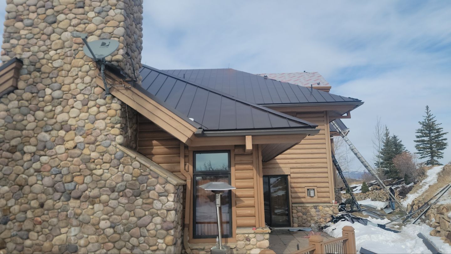 Standing Seam Metal Roof Replacement After Snow Damage by ASAP Roofing & Restoration
