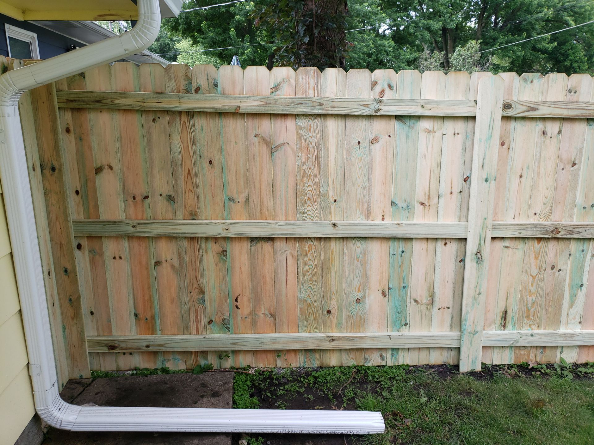 Custom Wood Privacy Fence Installation for Charles City Backyard by Perfect Picket Fence and Stain