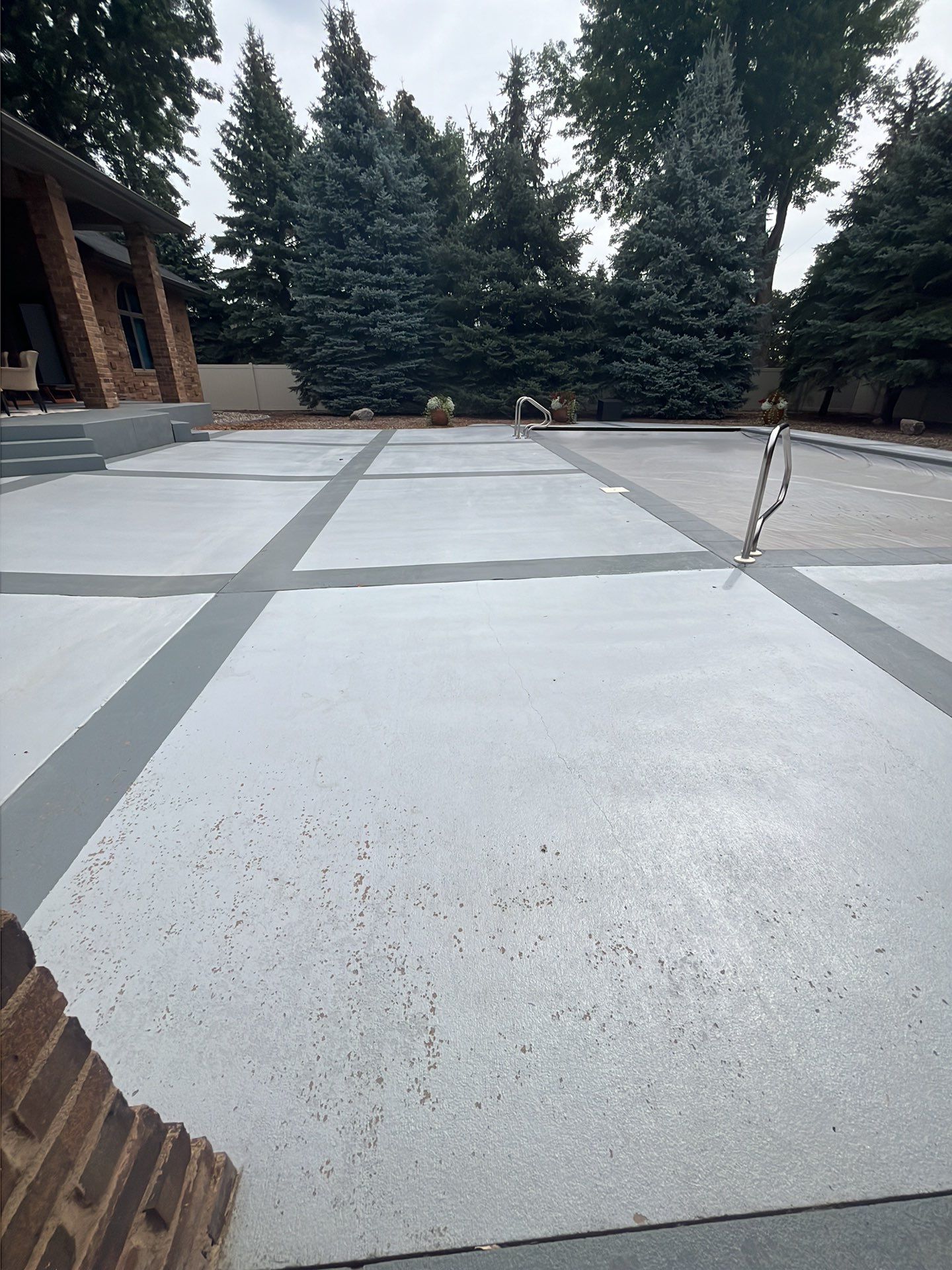 Decorative Concrete Pool Deck and Patio Resurfacing in Sioux Falls by Select Painting, Coatings & Garage Cabinets