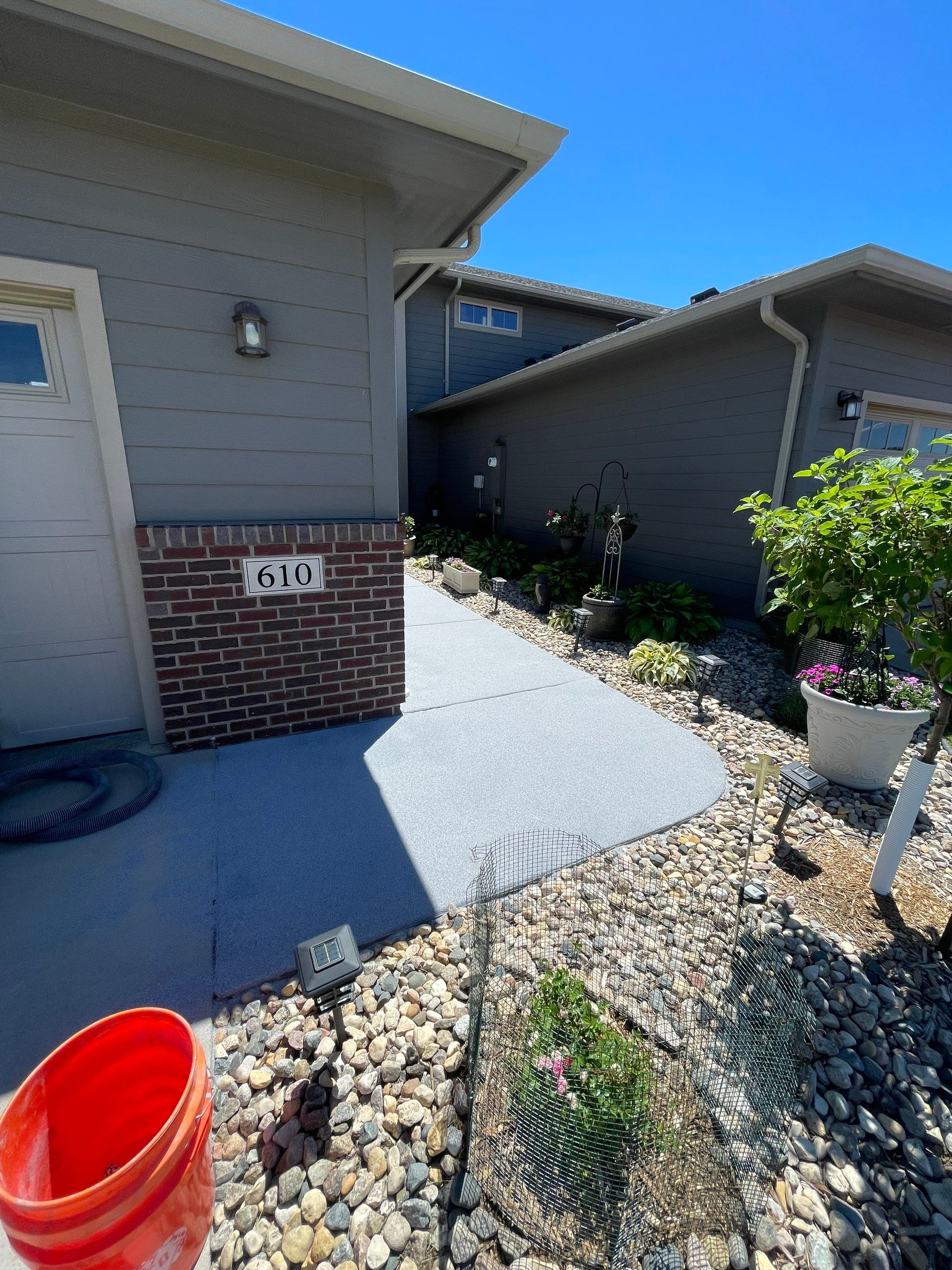 Custom Concrete Coating for Sioux Falls Patio and Front Walkway by Select Painting, Coatings & Garage Cabinets