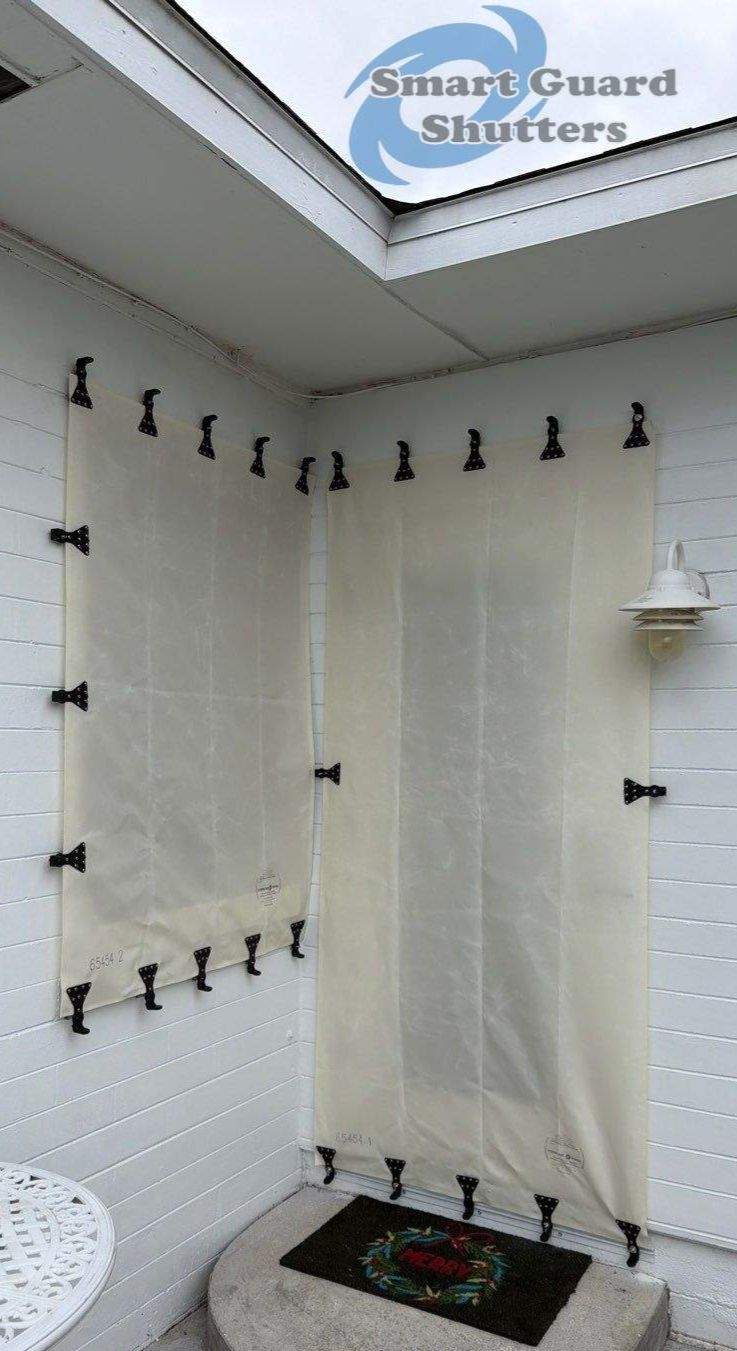 Hurricane Fabric in White / Decorative Bahama in Pastel Turquoise by Smart Guard Shutters