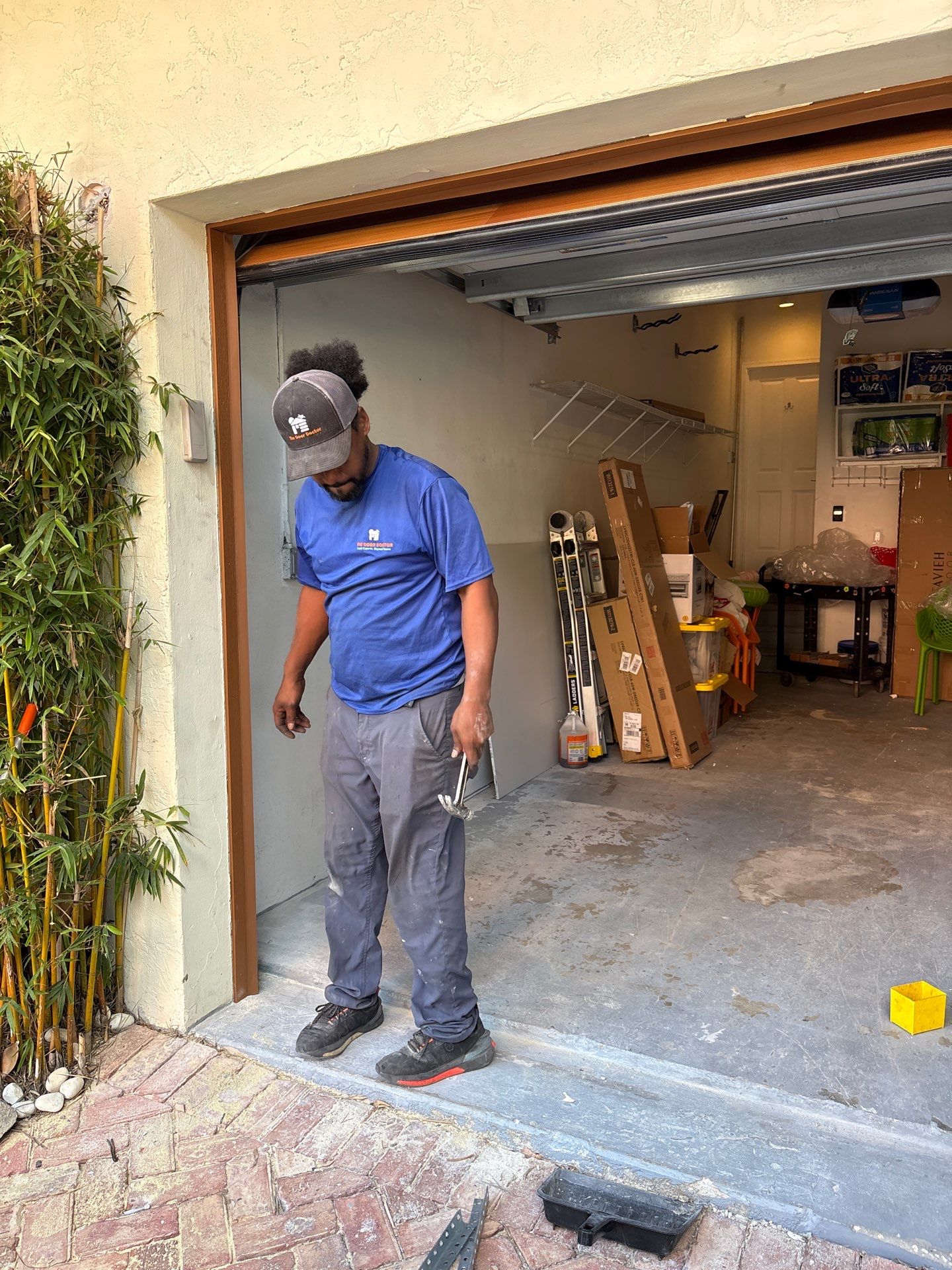 Modern Horizontal Wood Garage Door Installation in Fort Lauderdale by The Door Doctor of South Florida, Inc.