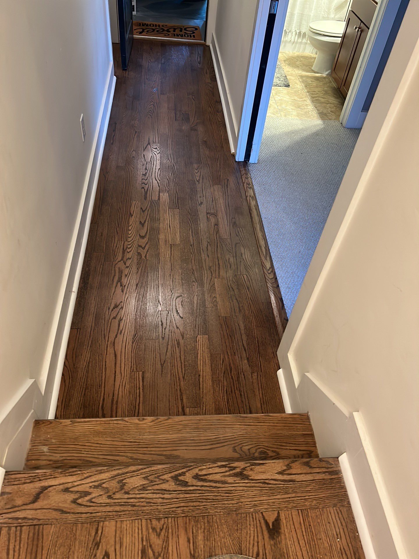 Classic Stair remodel with Oak Treads by Footprints Floors of East Atlanta