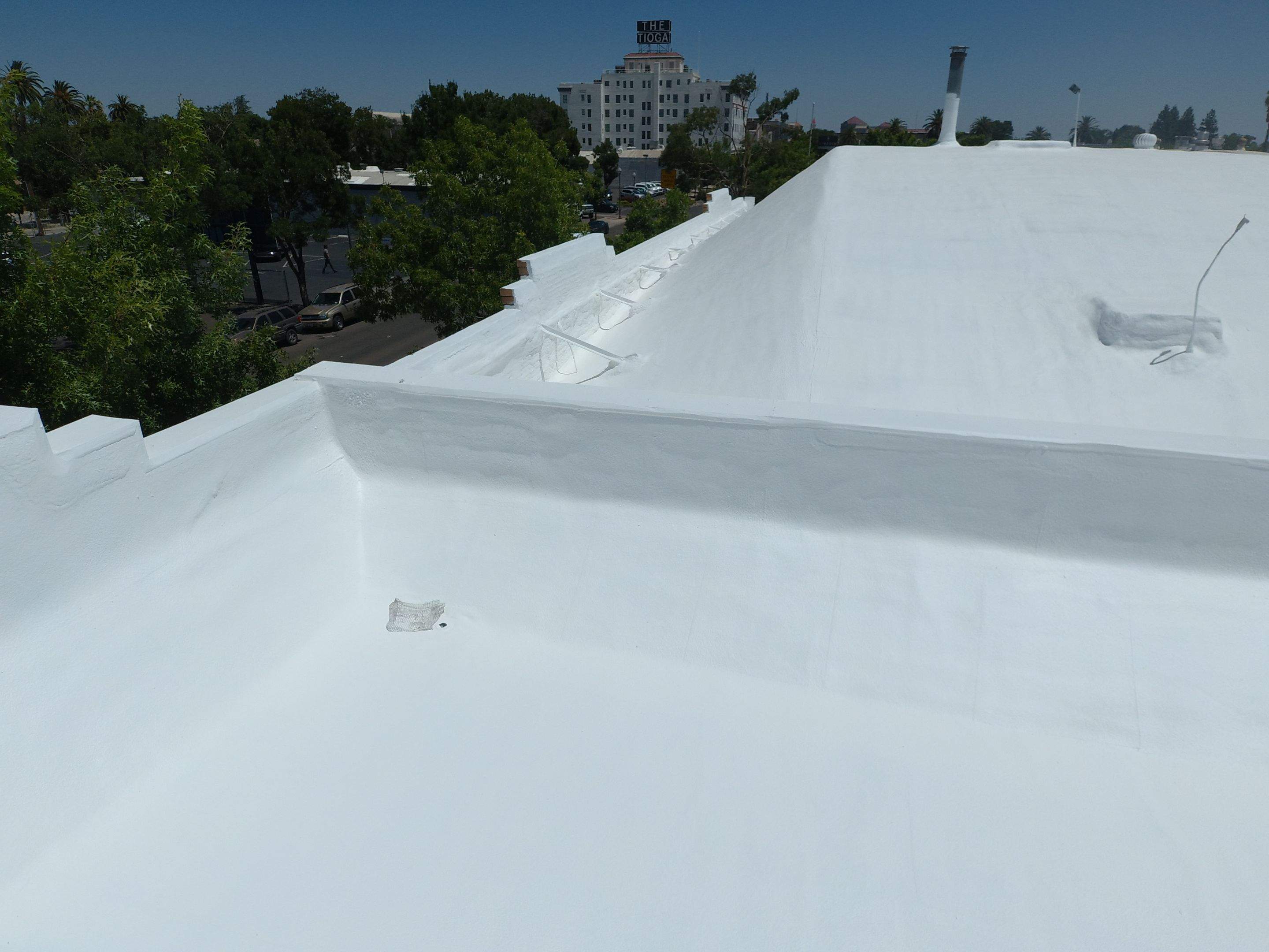 Spray foam and coatings using Conklin Benchmark/PUMA XL coatings and spray foam by Straight Edge Roofing Inc