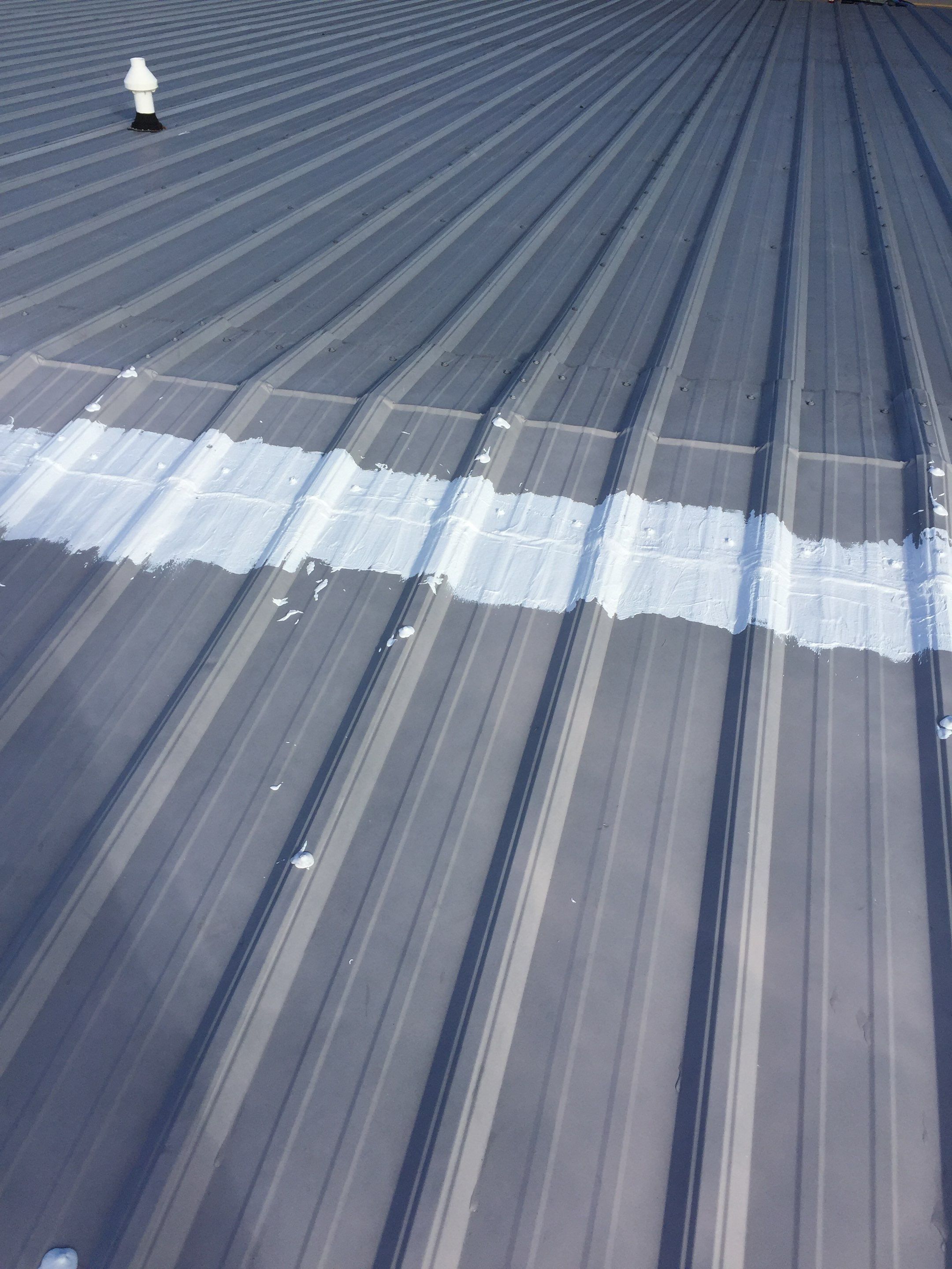 Commercial Roof Coating using Gaco Silicone Roof Coating by Secure Construction Company Inc