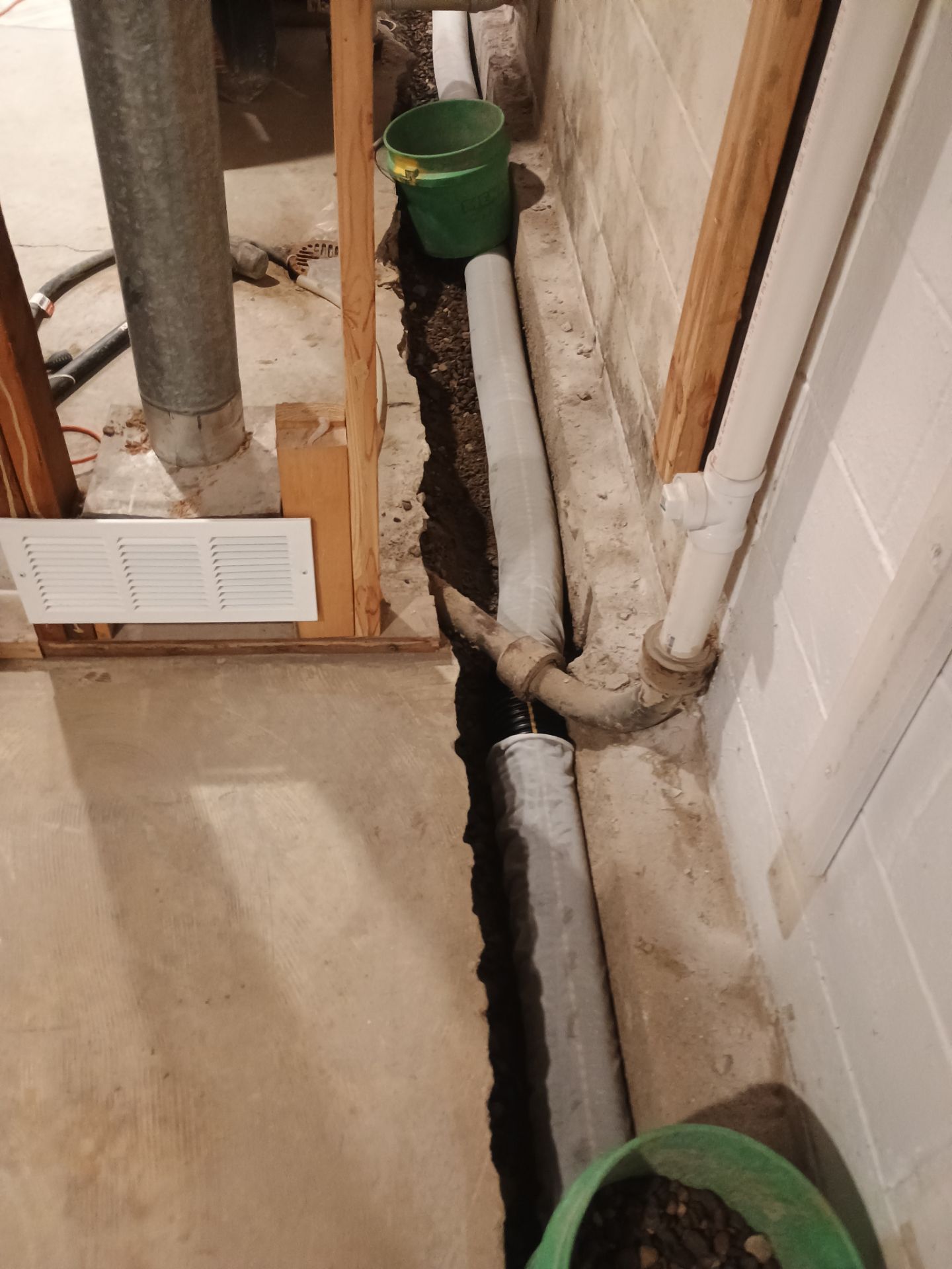 Interior Drain Tile & Buried Discharge in St. Anthony, MN by Waterproofing Northeast