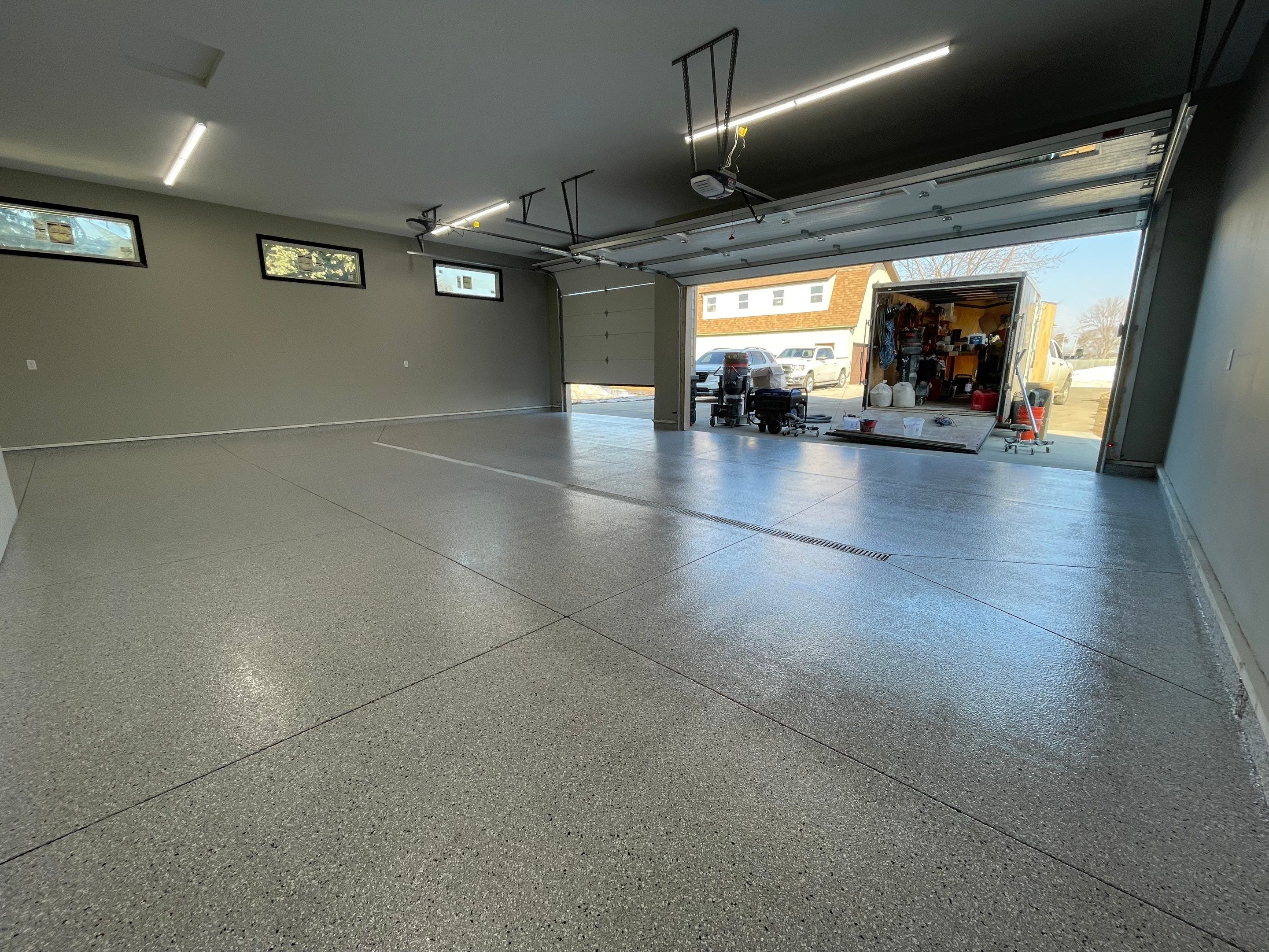 Decorative Flake Concrete Coating Installation in North Sioux City by Select Painting, Coatings & Garage Cabinets