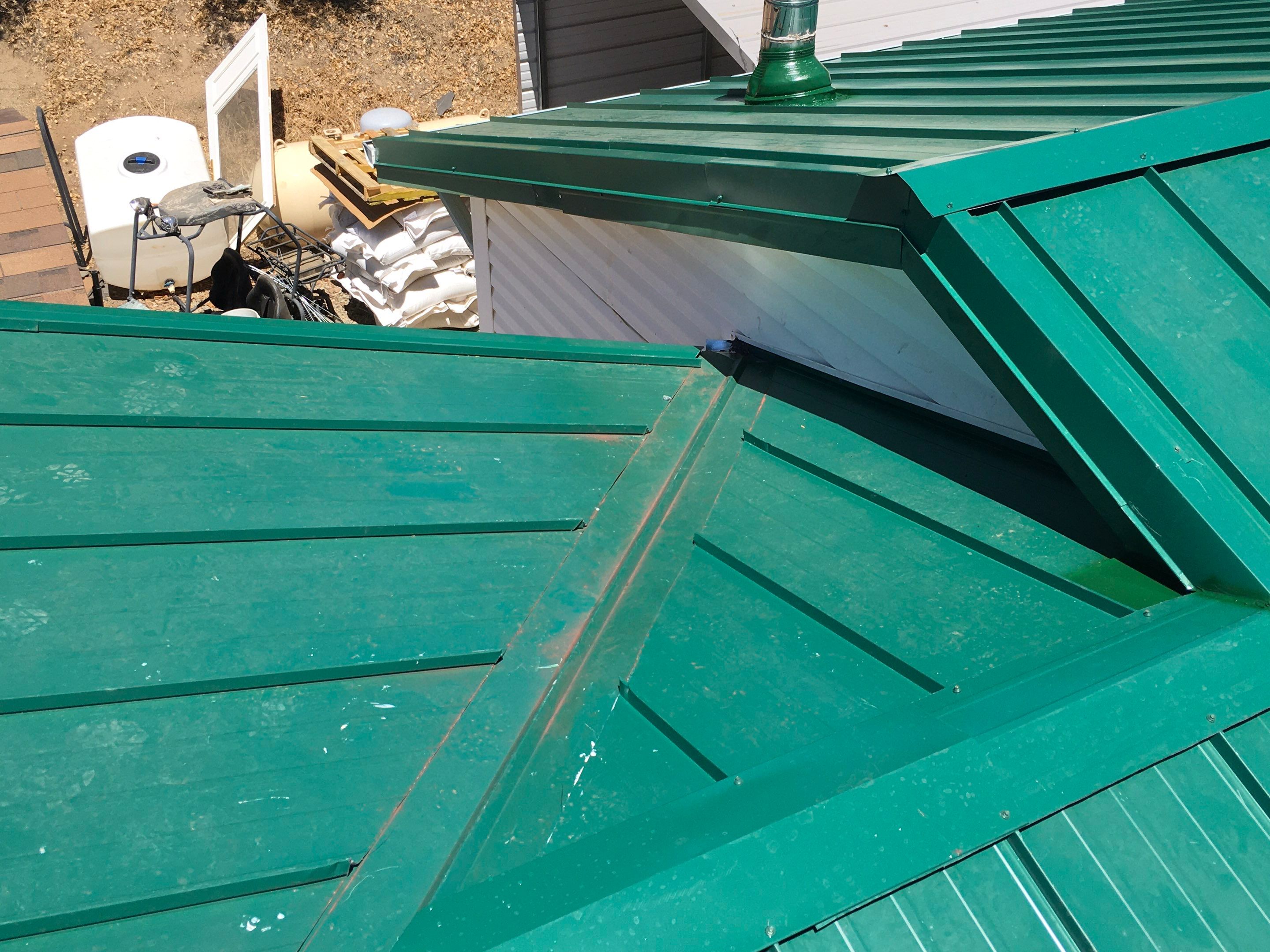 Metal roofing installation using Standing seam metal roofing system by Straight Edge Roofing Inc