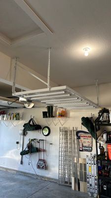 Darlene maximized their storage with overhead racks.