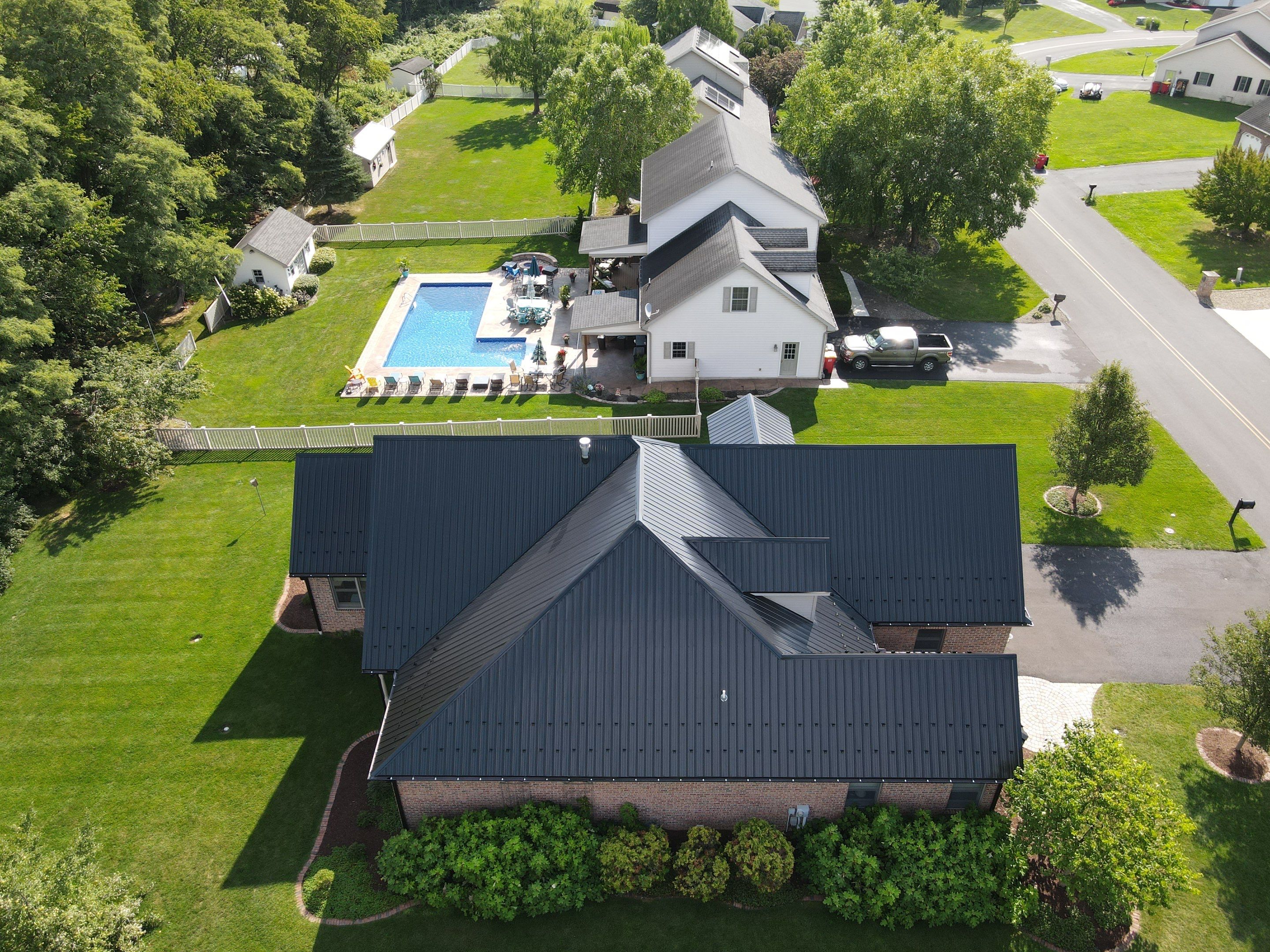 Standing seam / Azm panel in black  by Teflon Roofing