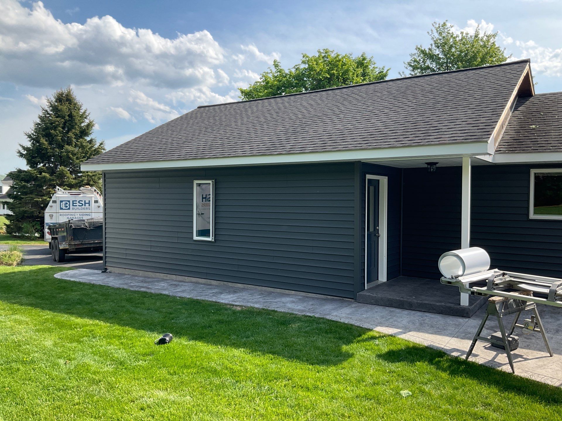 Nightfall Exterior Siding Replacement and Stone Veneer in Halifax by Esh Builders