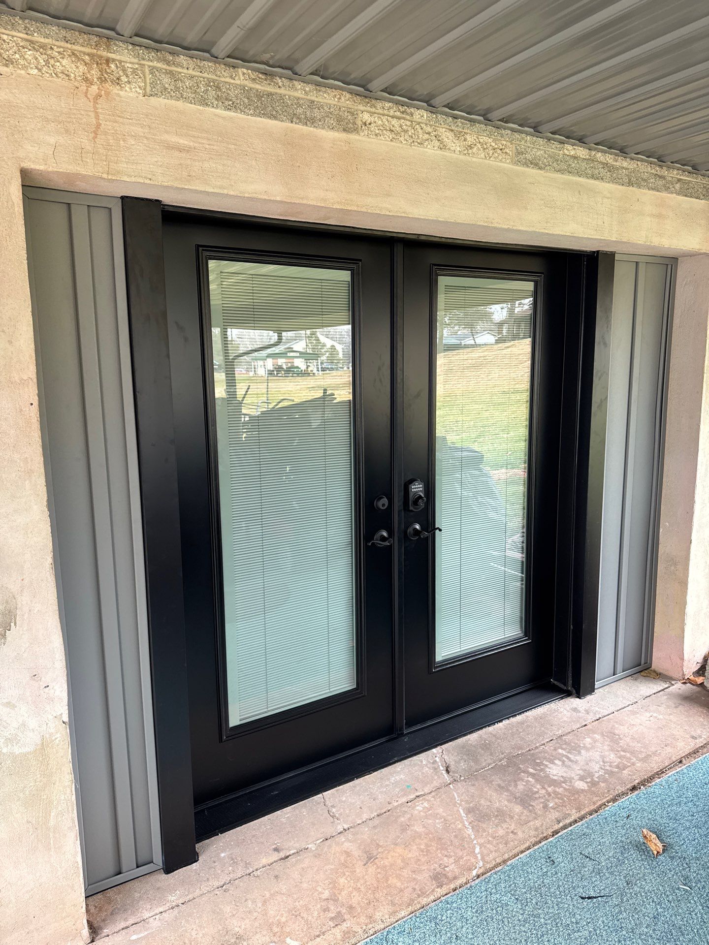 Metal Roofing, Board & Batten Siding, and Entry Door Transformation by Esh Builders