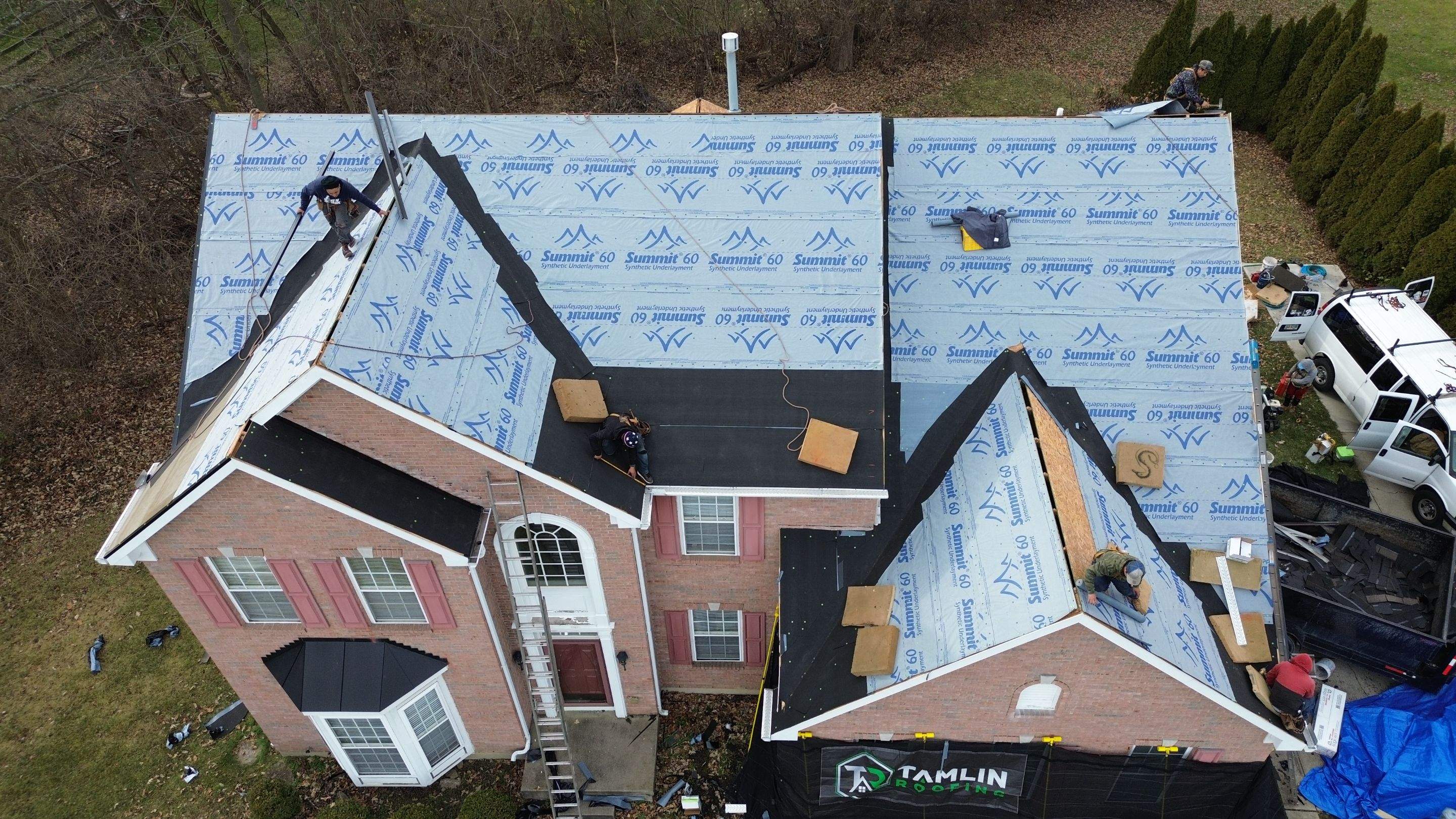 Walden Ponds - Pristine Black and Hydro Flo Gutter Guards by Tamlin Roofing