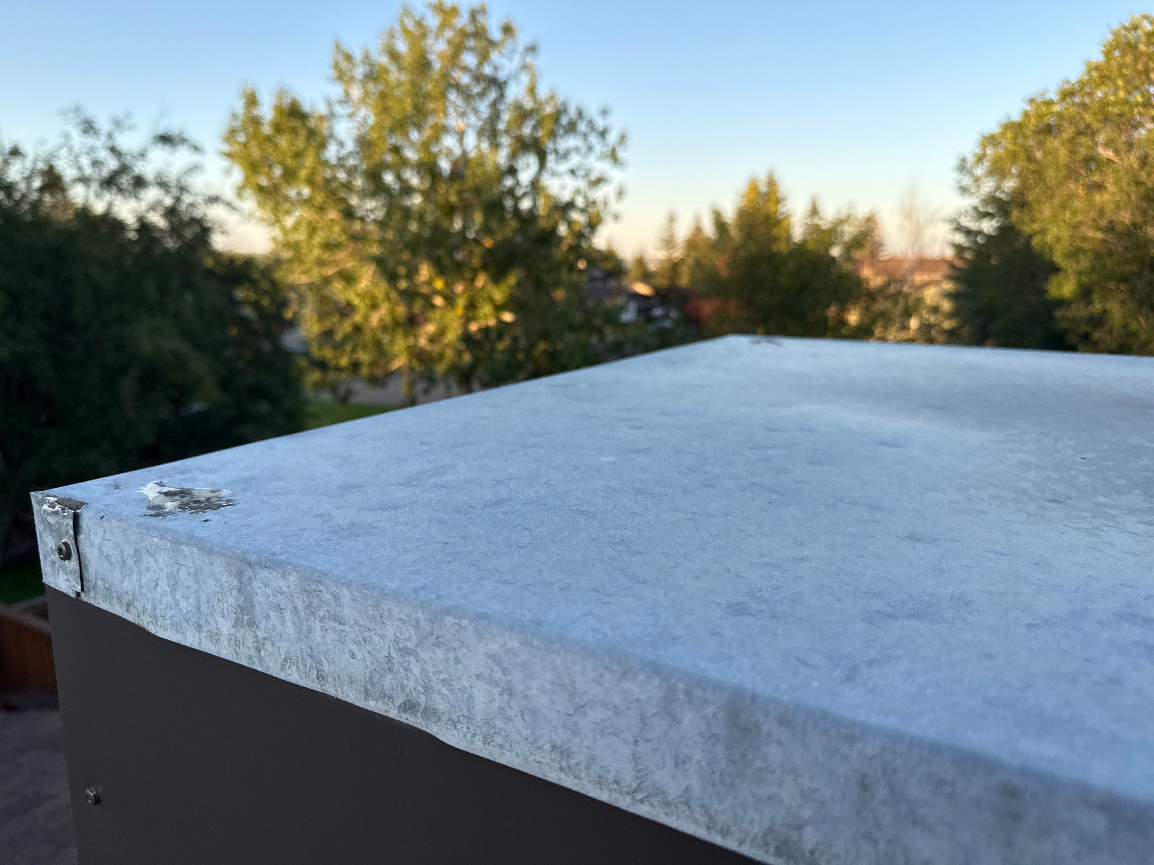 Calgary Chimney Chase Reconstruction and Exterior Siding Replacement by Smart Home Building Systems Ltd.