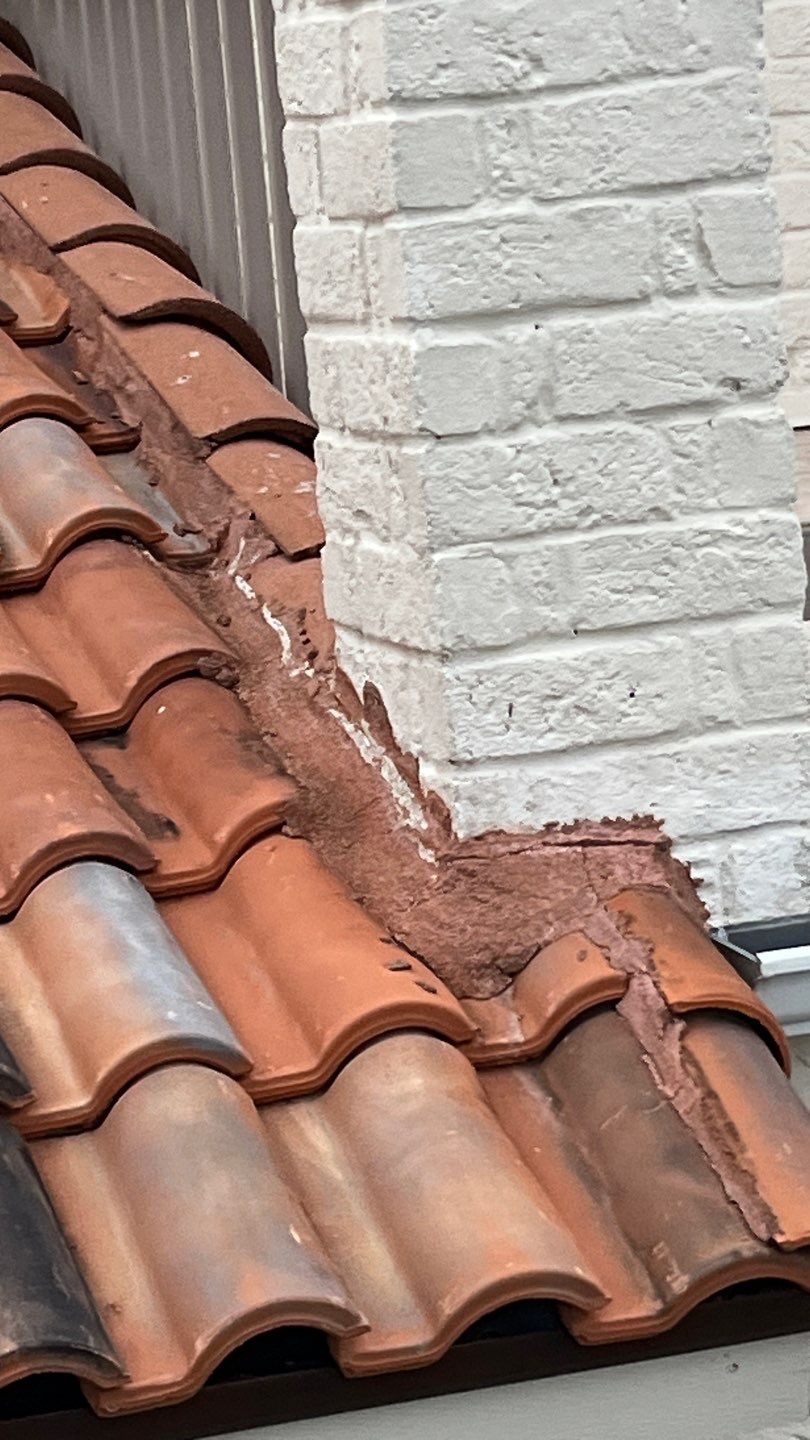 Off with the Tile and on with the TILCOR stone coated metal.  by Bayfront Roofing and Construction