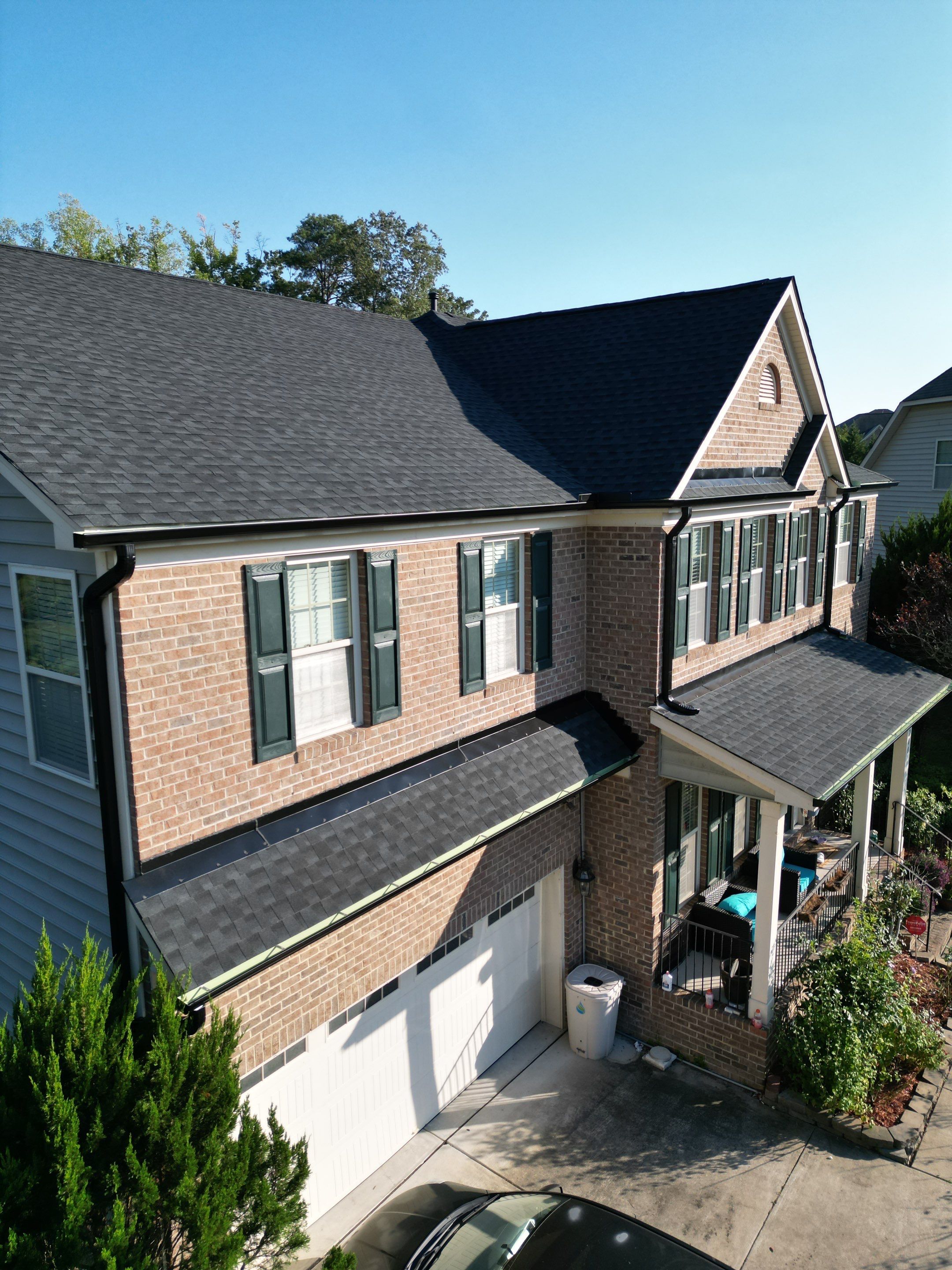 Roof Replacment - GAF Timberline HDZ Charcoal with 5” black seamless gutters  by Pro Performance Roofing