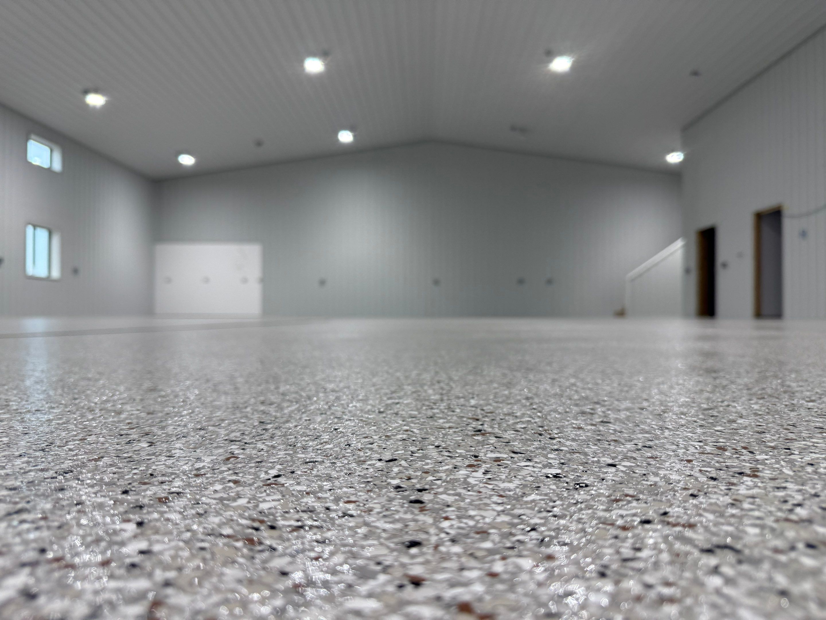 Custom Speckled Floor Coating for Large Montrose Shop by Select Painting, Coatings & Garage Cabinets