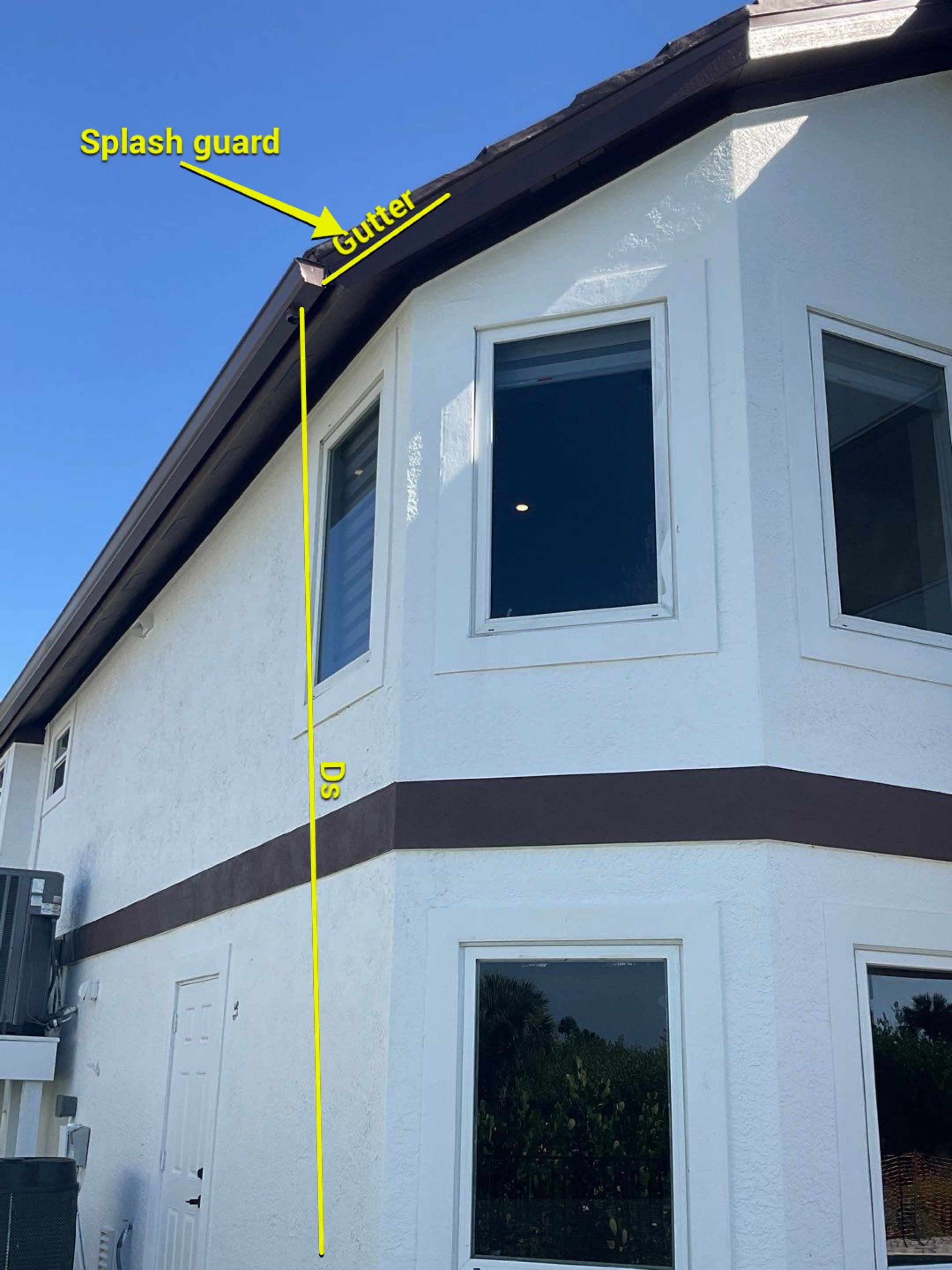 Musket Brown 7-Inch Gutters and White Down Spouts in Sanibel FL by Gutter Professors