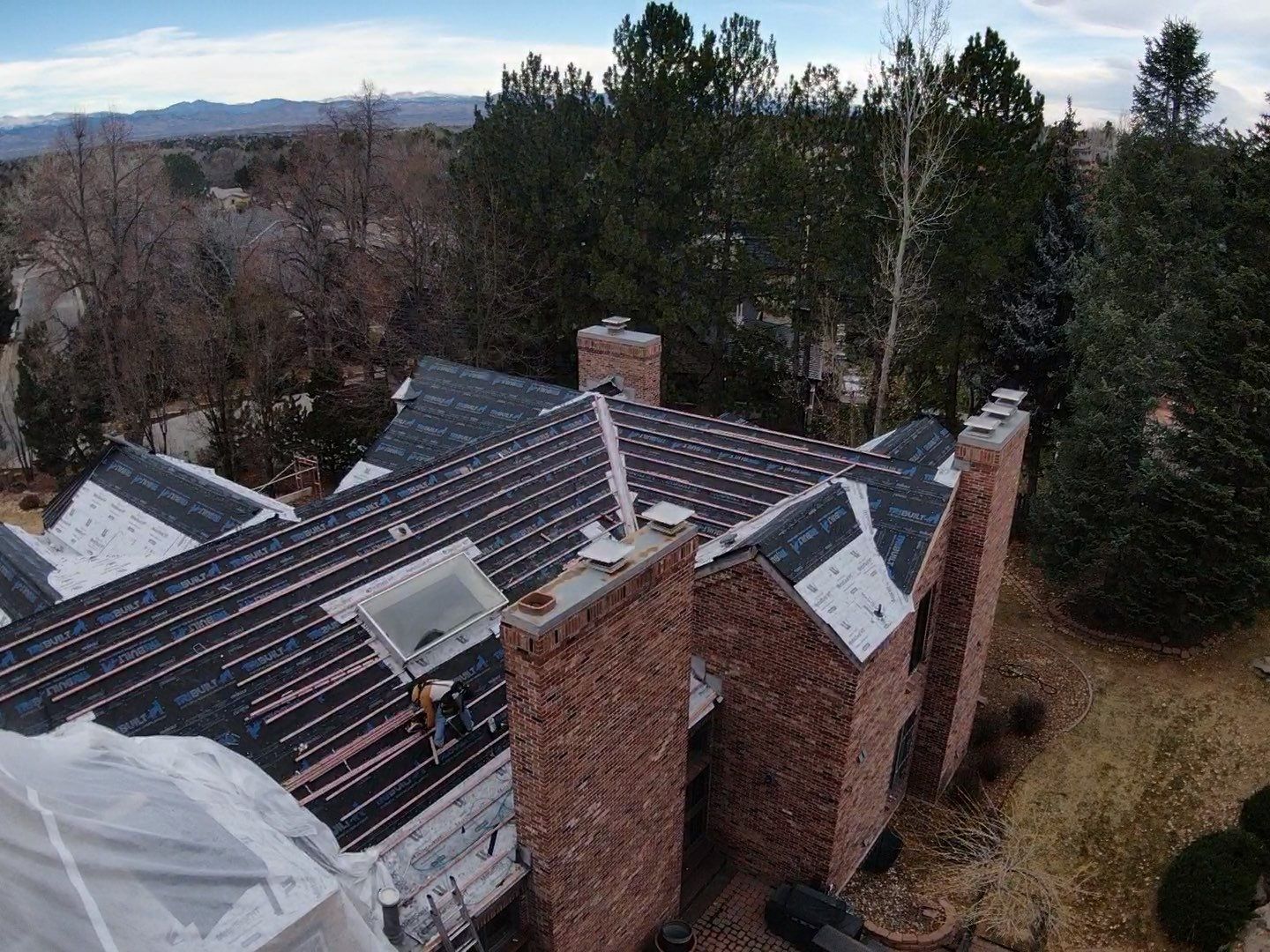 Unified Stone Coated Roof & Stucco Remodle by Blue Peaks Roofing LLC