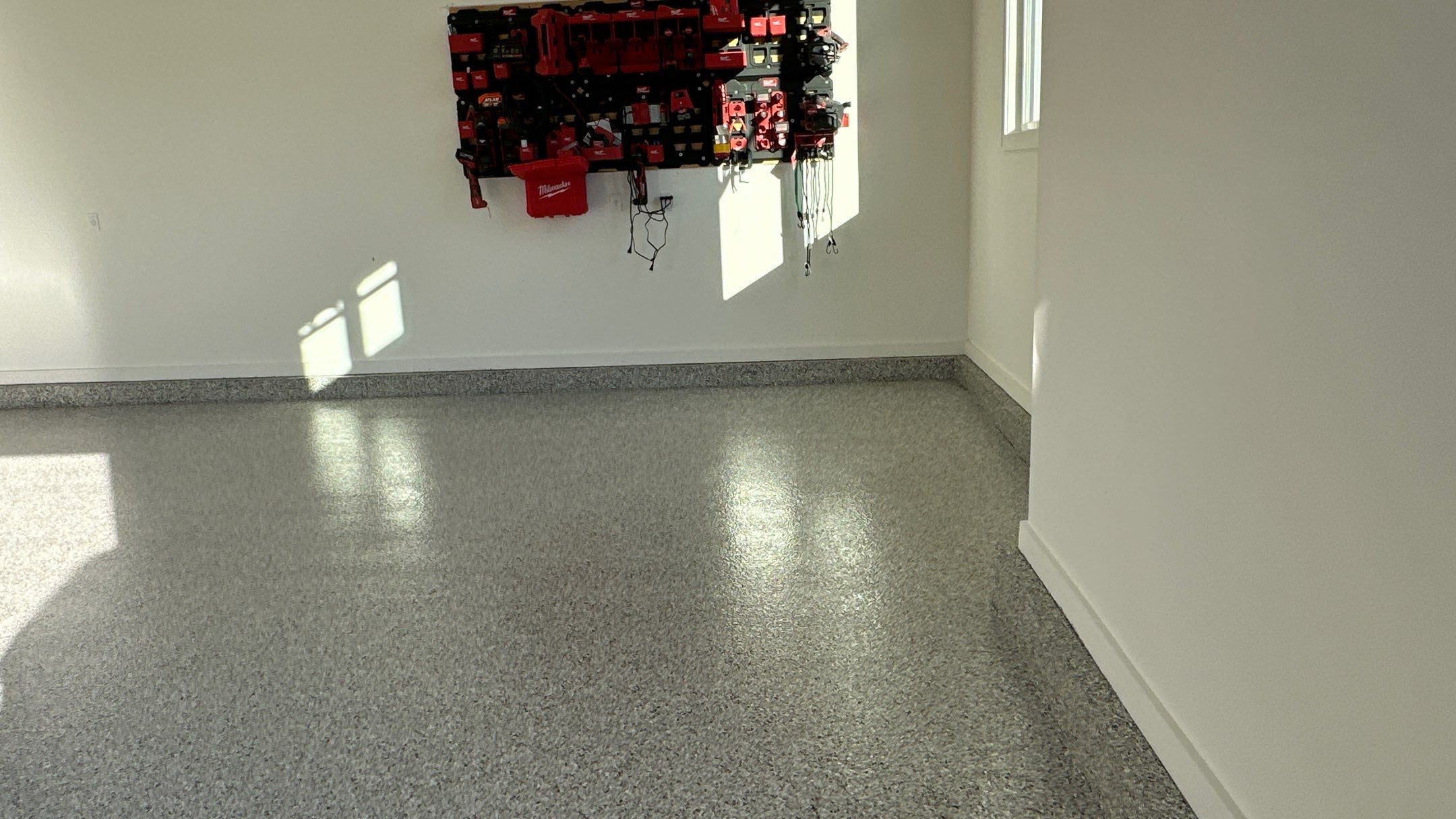 Mike M. got him self a beautiful Coyote flake floor by Banner Garage