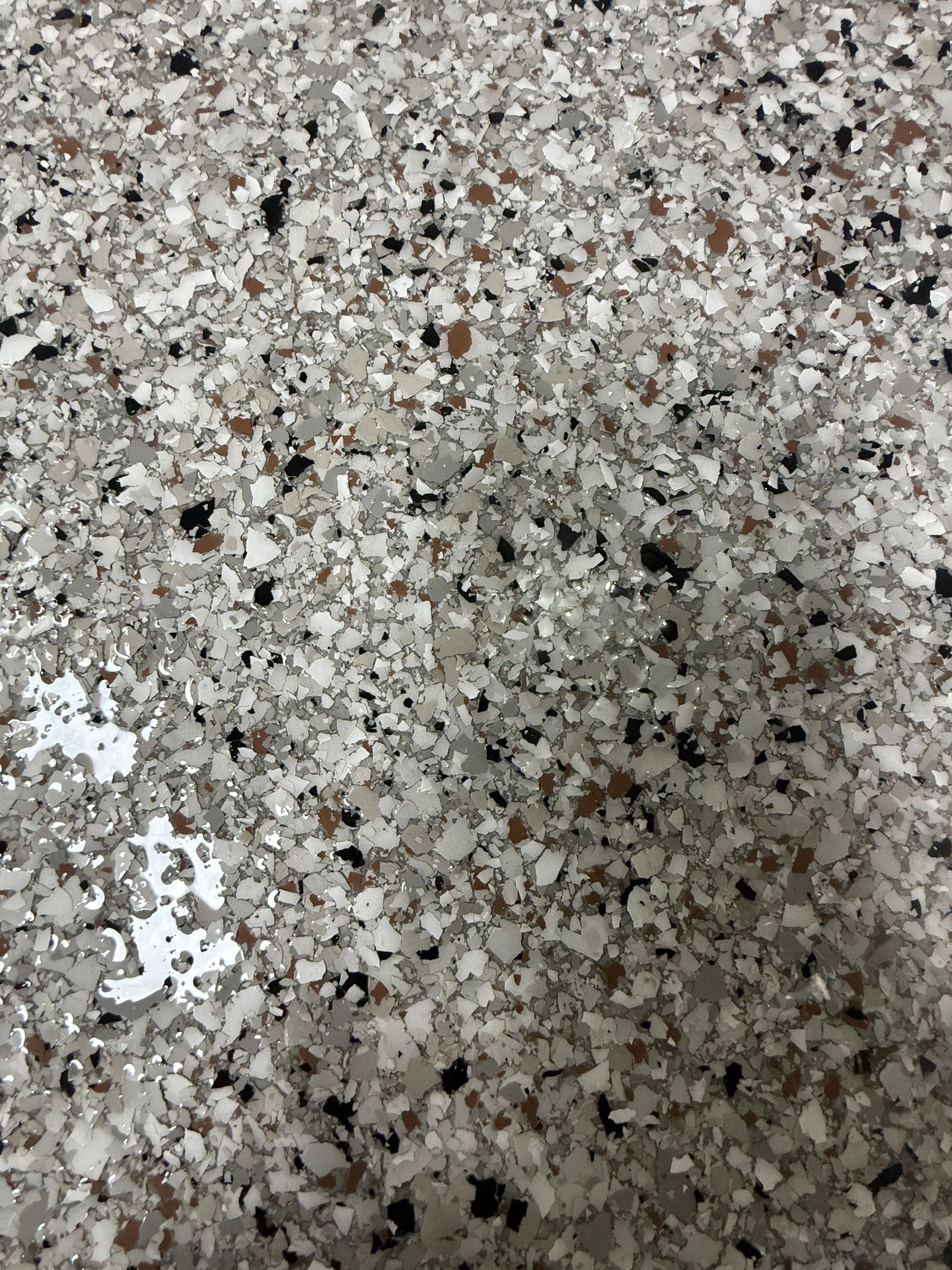 High-Gloss Epoxy Garage Floor Coating in Sioux Falls by Select Painting, Coatings & Garage Cabinets