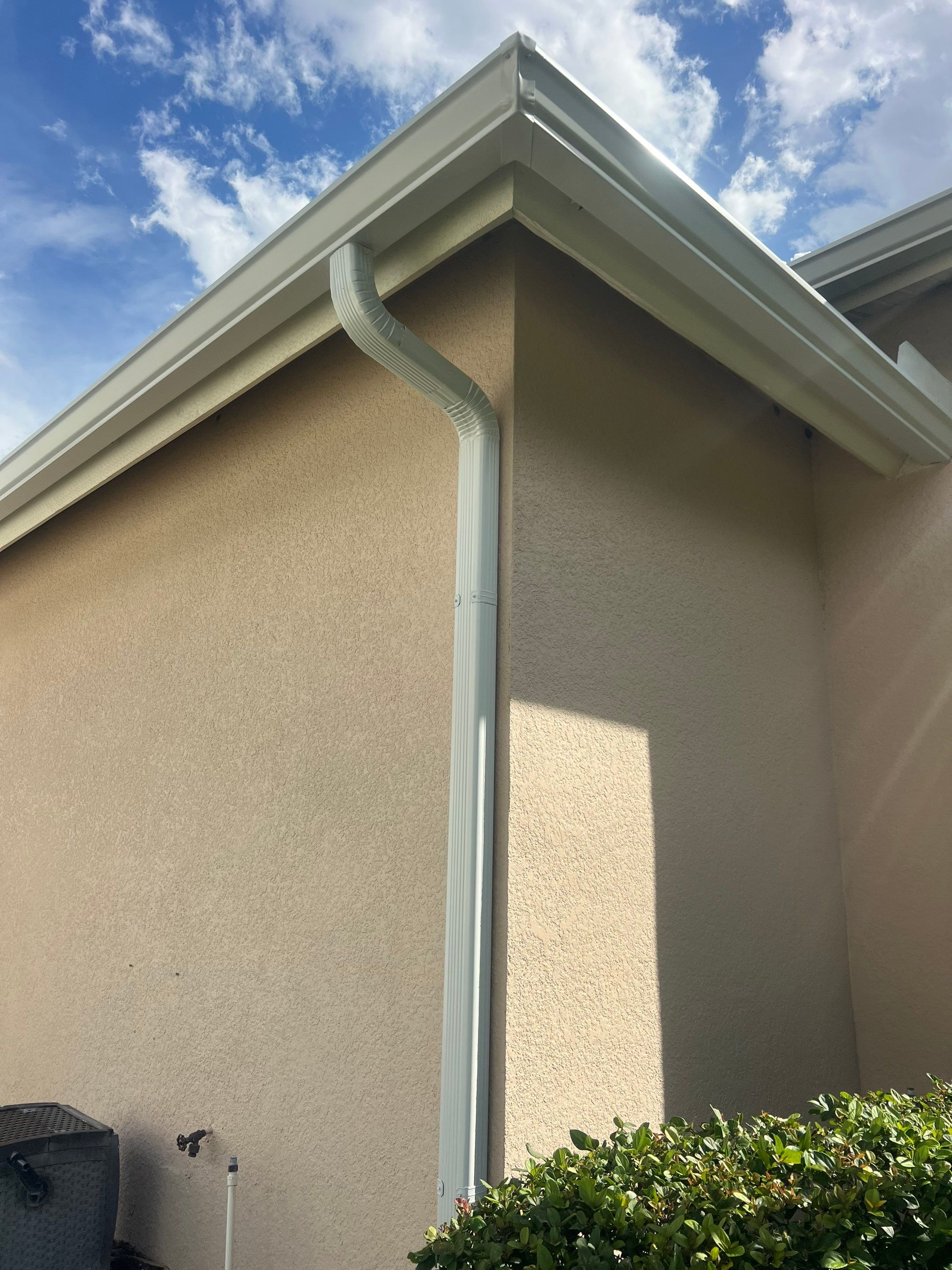 White Gutters and White Downspouts by Gutter Professors