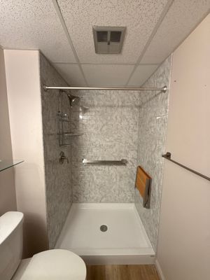 Jacuzzi Walk-In Shower Installation with Marble Accents in Traverse City