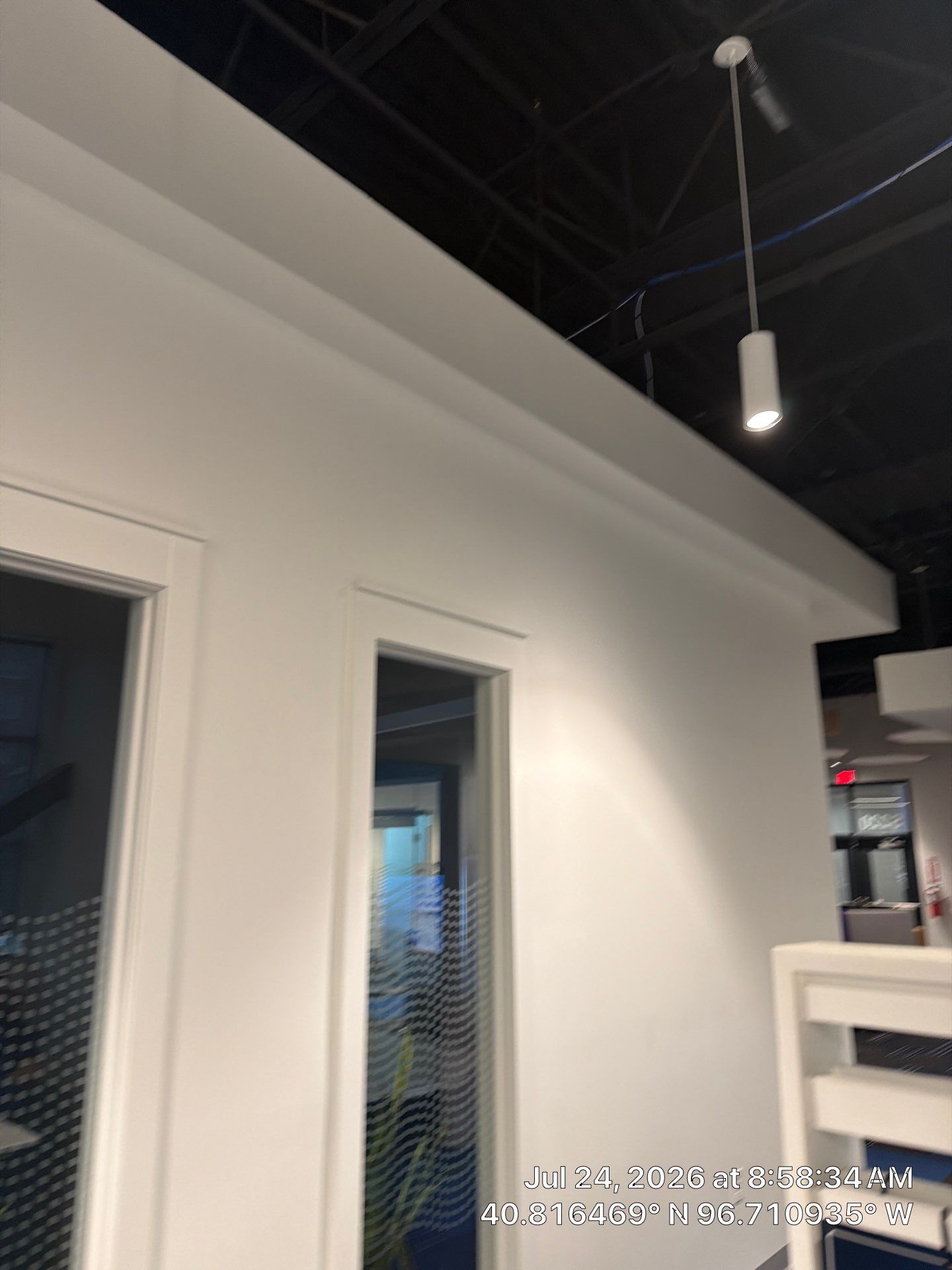 Lincoln Commercial Office Remodel with Glass Doors and Acoustic Baffles by CompanyCam Sales Demo