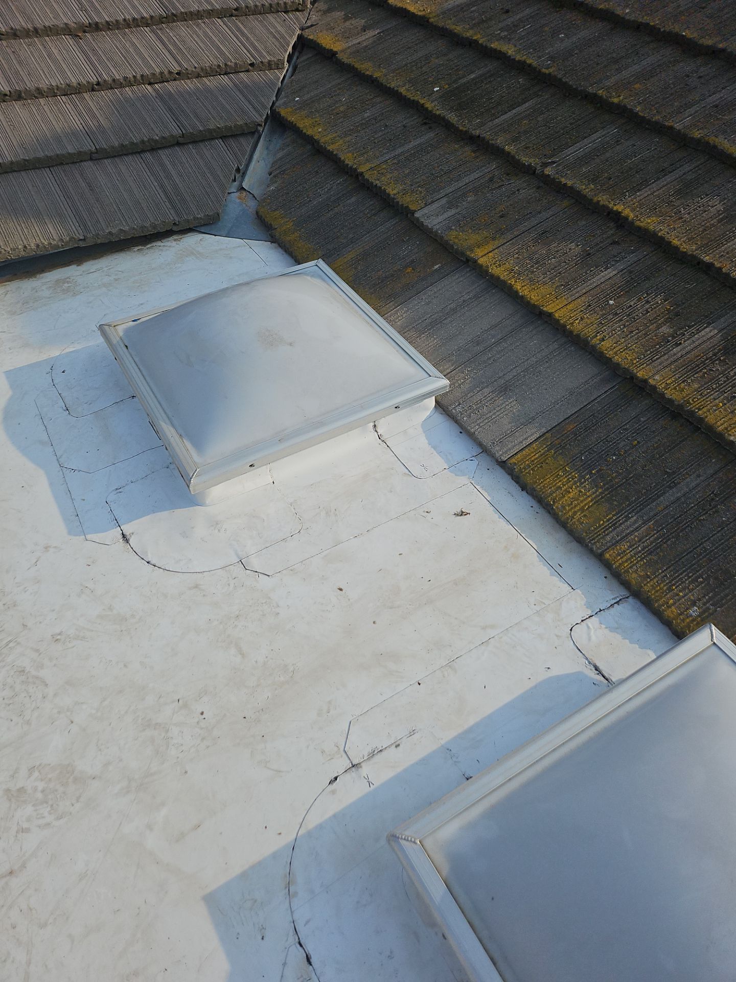 Single-ply roofing system on porch using TPO 60 mil by Straight Edge Roofing Inc