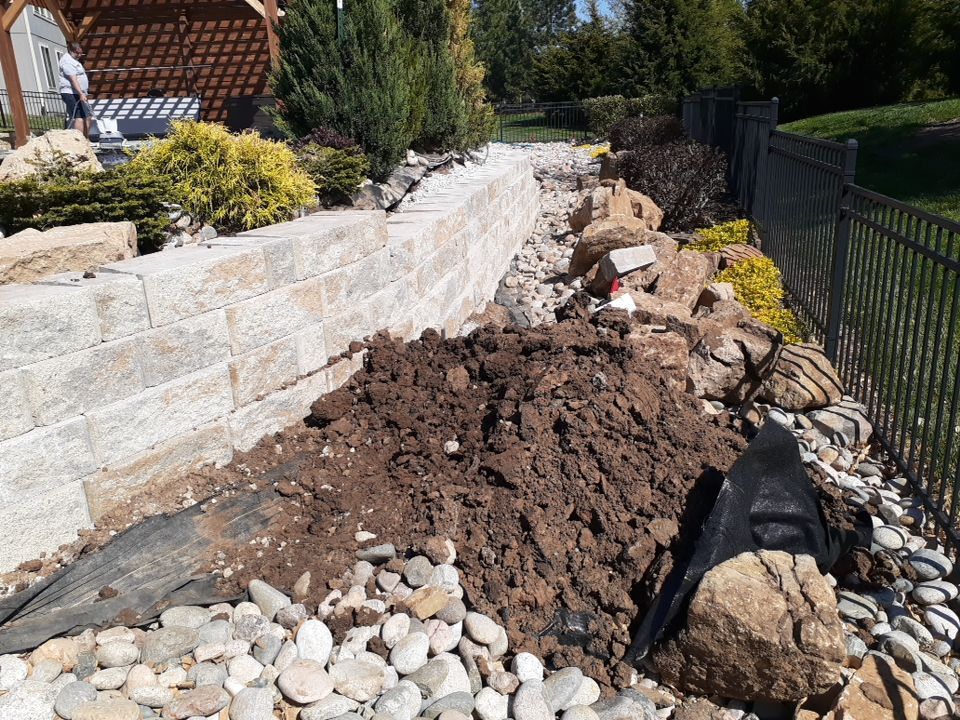 Pool Retaining Wall by LAND ESCAPES LLC