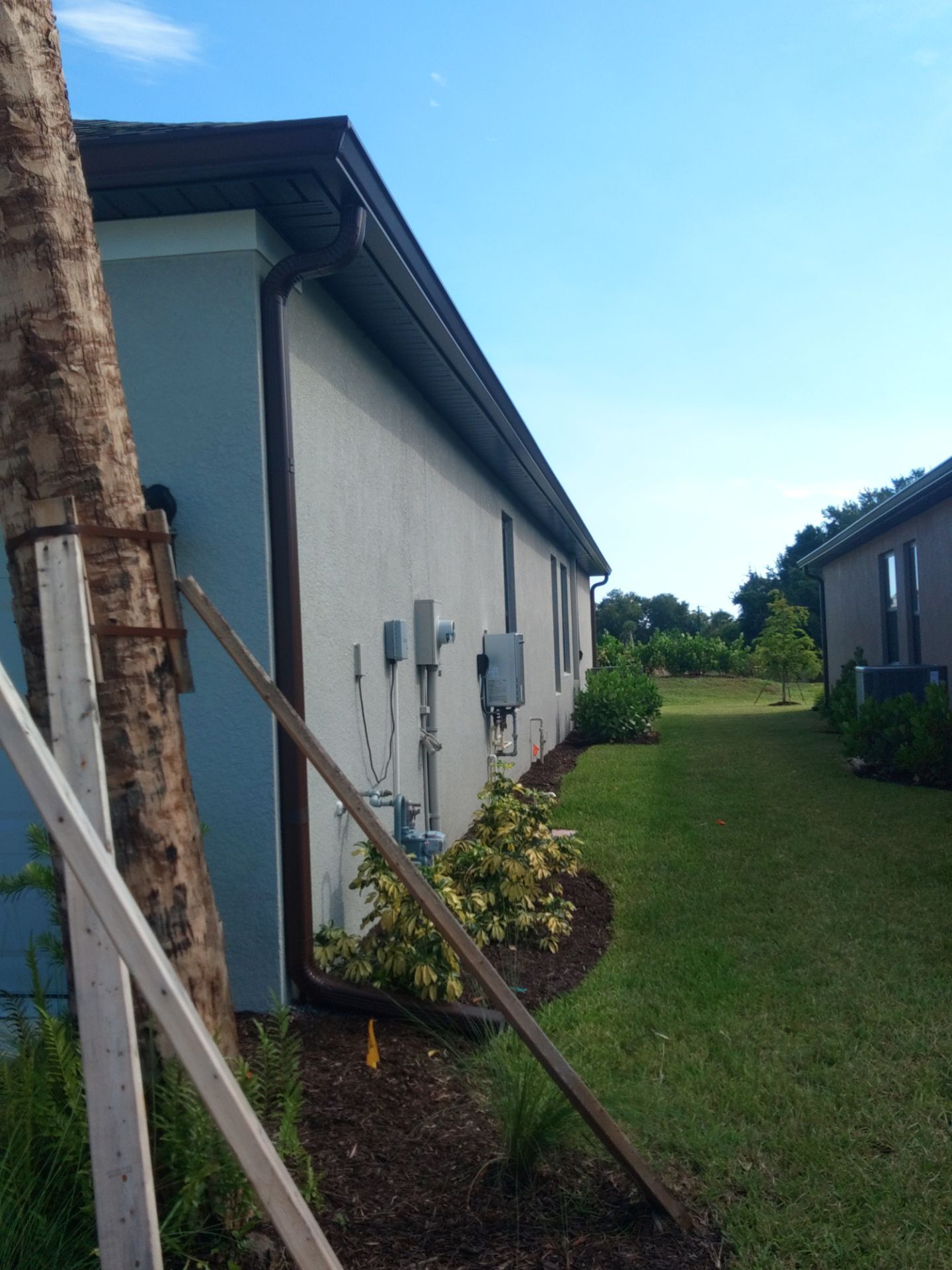 Musket Brown Seamless Gutters using Musket Brown Seamless Gutters in Nokomis FL by Gutter Professors