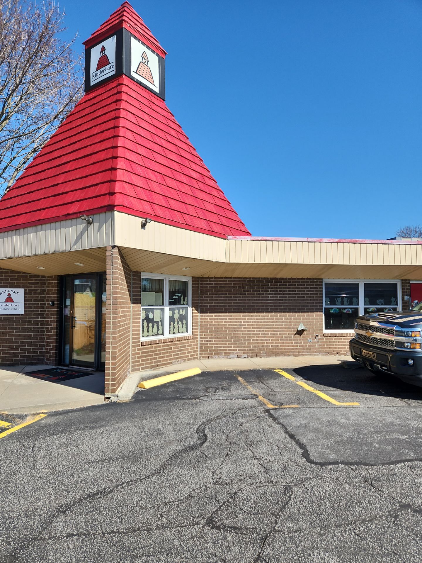 Commercial Roofing Repair using UniFlex Silicone Roof Coating on KinderCare Learning Center by 3 Daughters Construction 