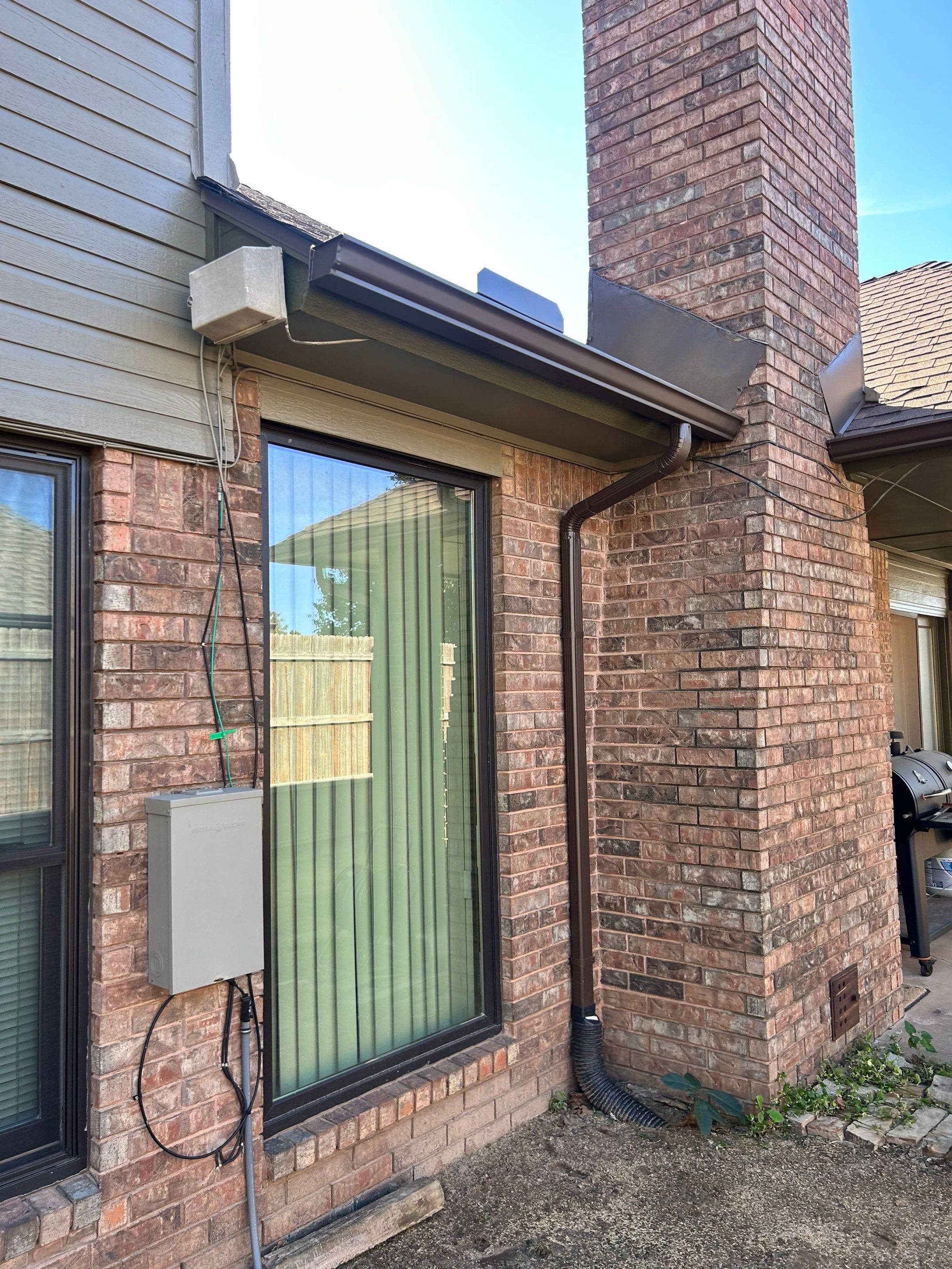 Gutter installations and exterior painting by McCann's Roofing and Construction