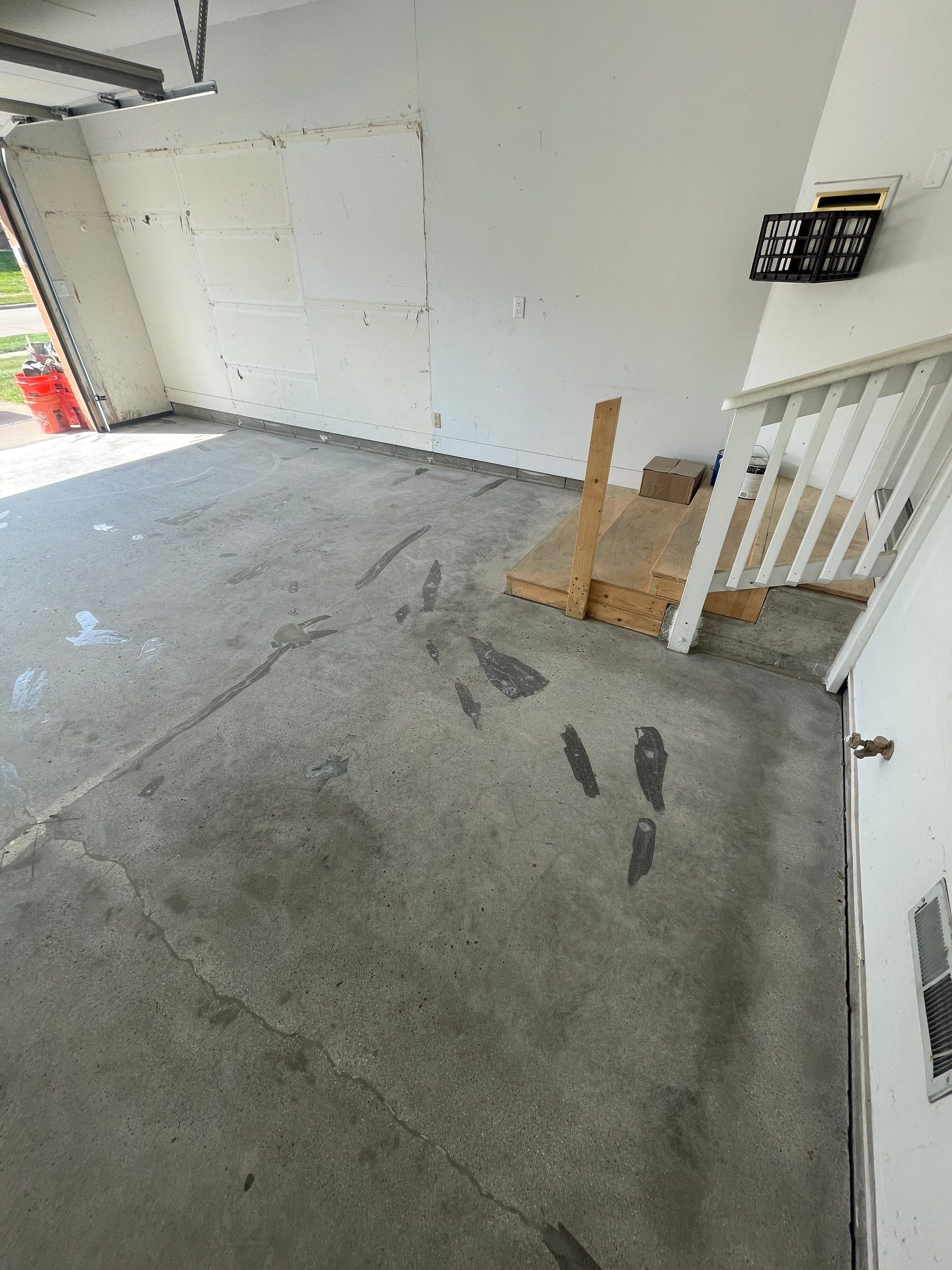 Grey Speckled Concrete Coating for Residential Garage in Yankton by Select Painting, Coatings & Garage Cabinets