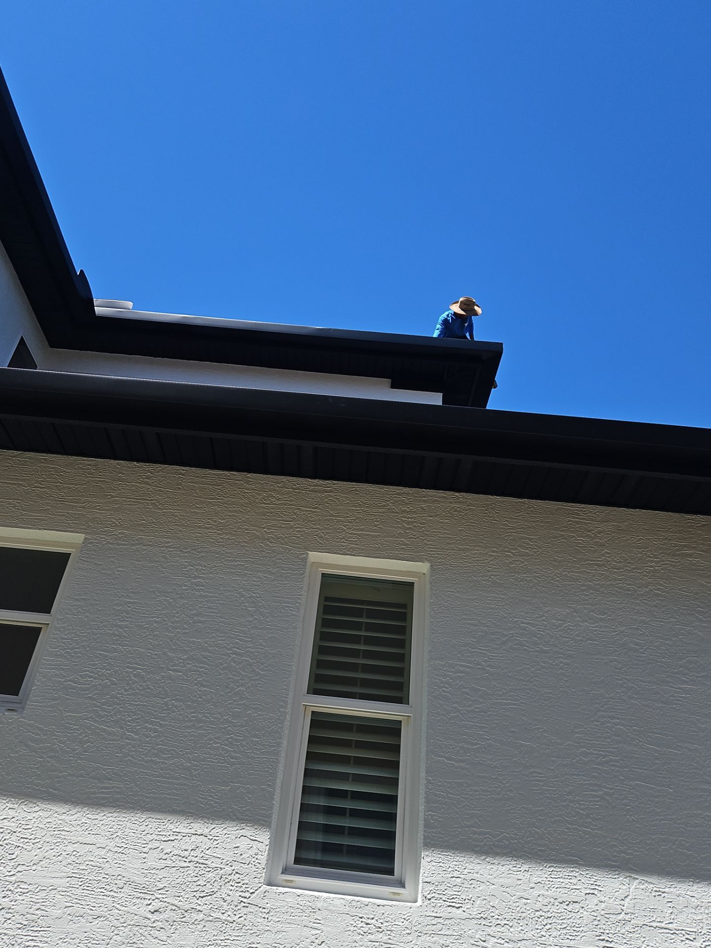 Soffit and Fascia Installation and black seamless gutters in Sarasota FL by Gutter Professors