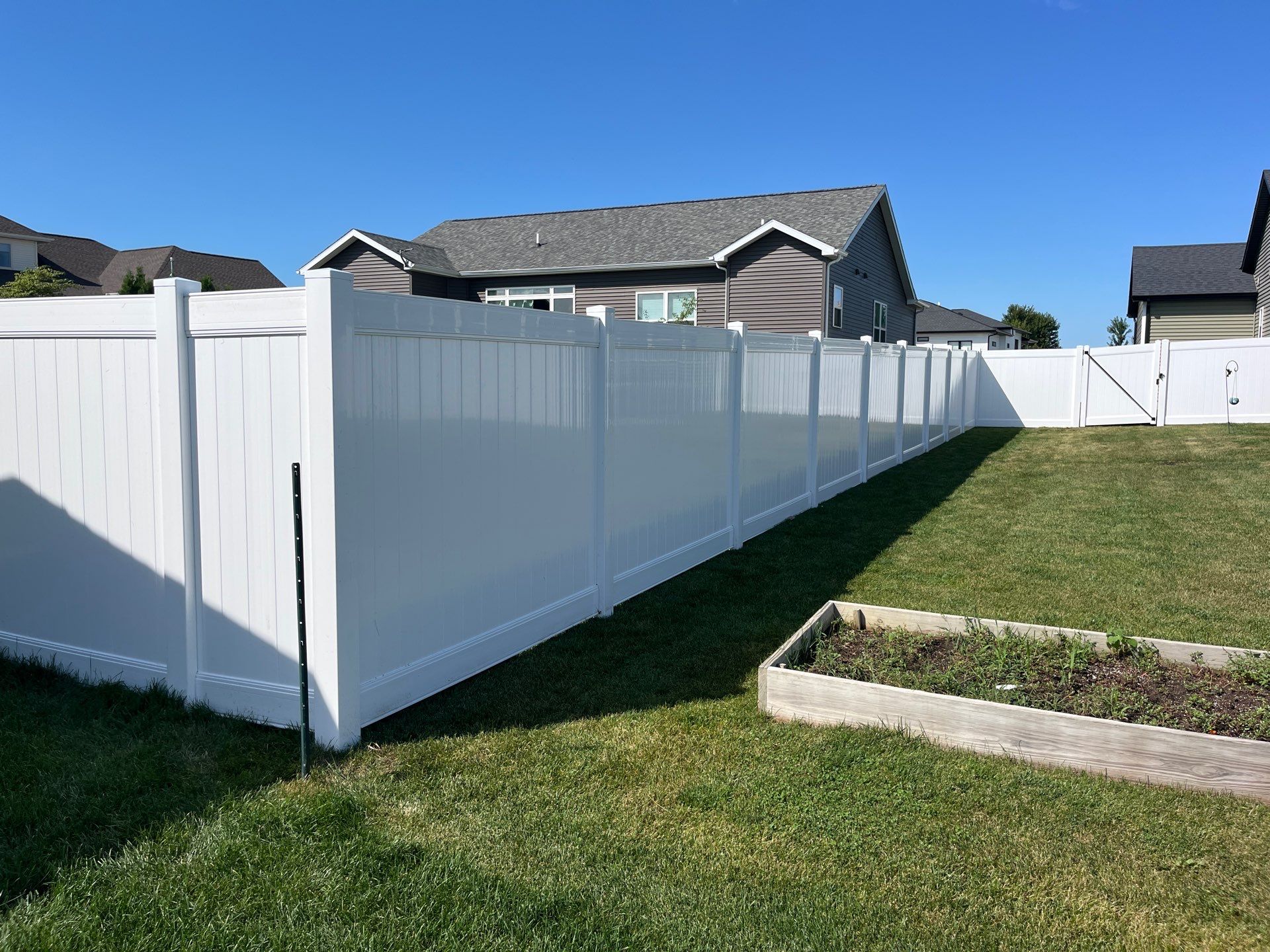 New Vinyl Privacy Fencing and Gates for Waterloo Residential Backyard by Perfect Picket Fence and Stain