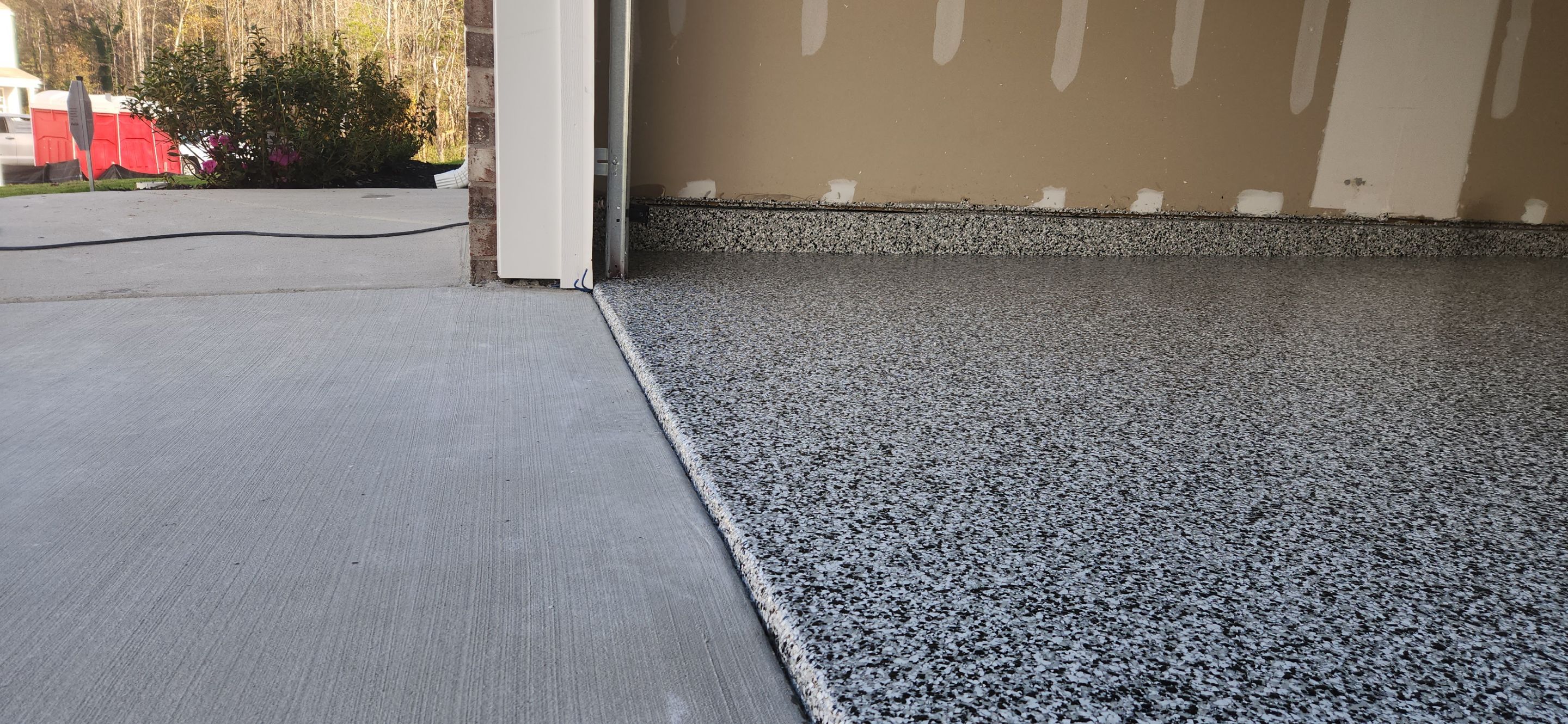 Garage & Back Patio using Domino & Pumice by Elite Floor Solutions